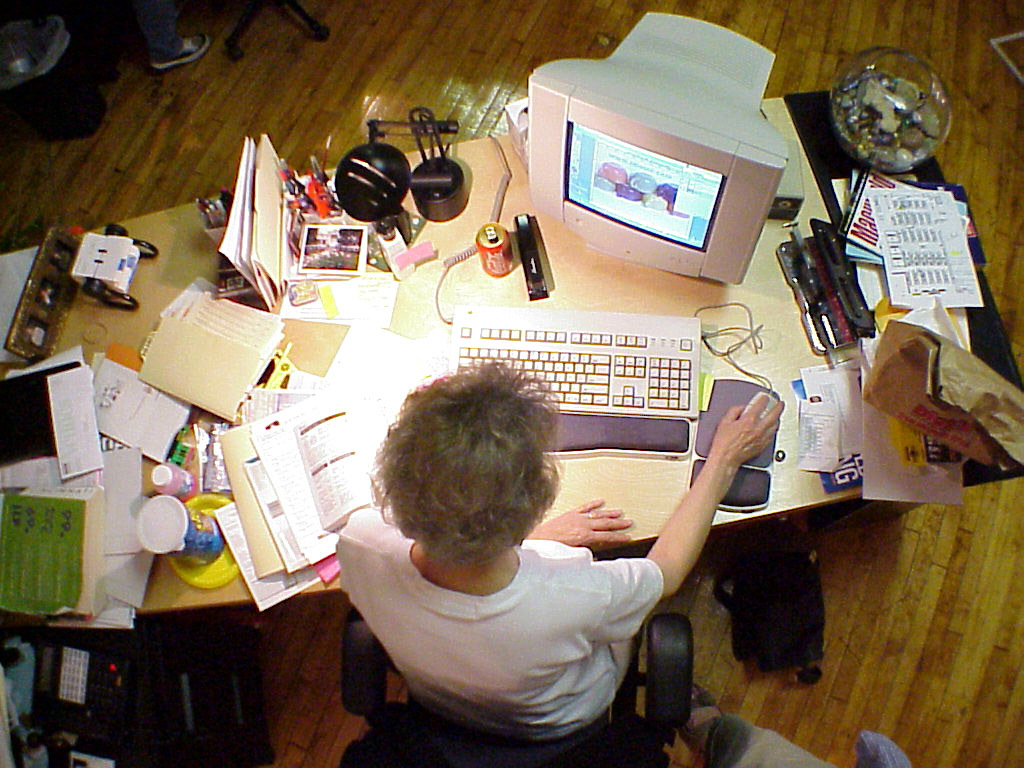 Woman at desk with CRT monitor - Sony Cybershot