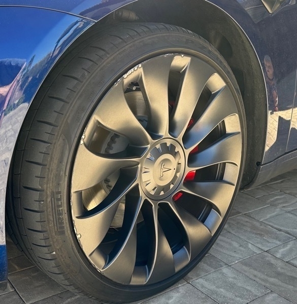 Tesla Ubertine wheel with curb rash