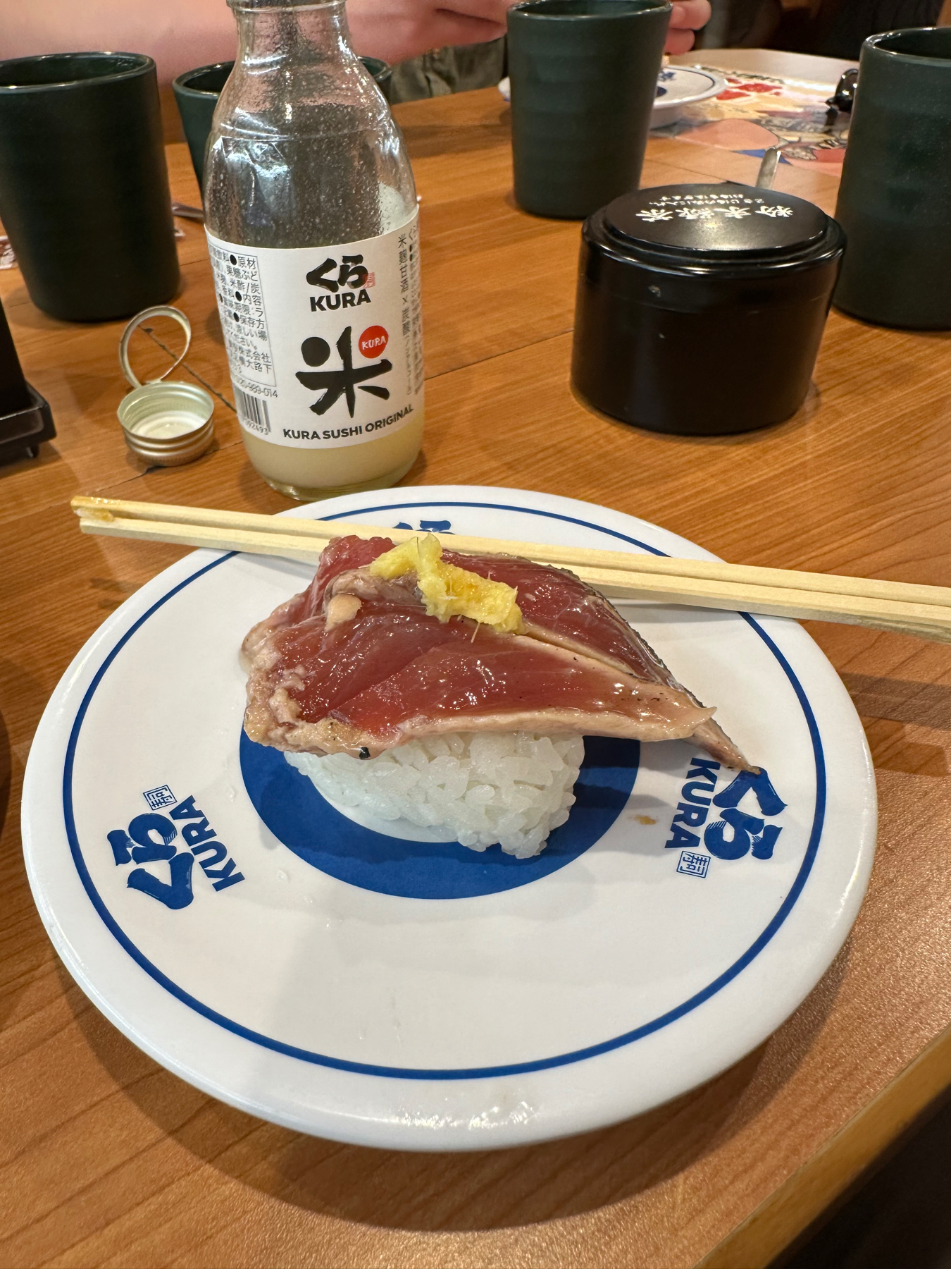 A small plate of raw tuna sushi with yuzu dressing