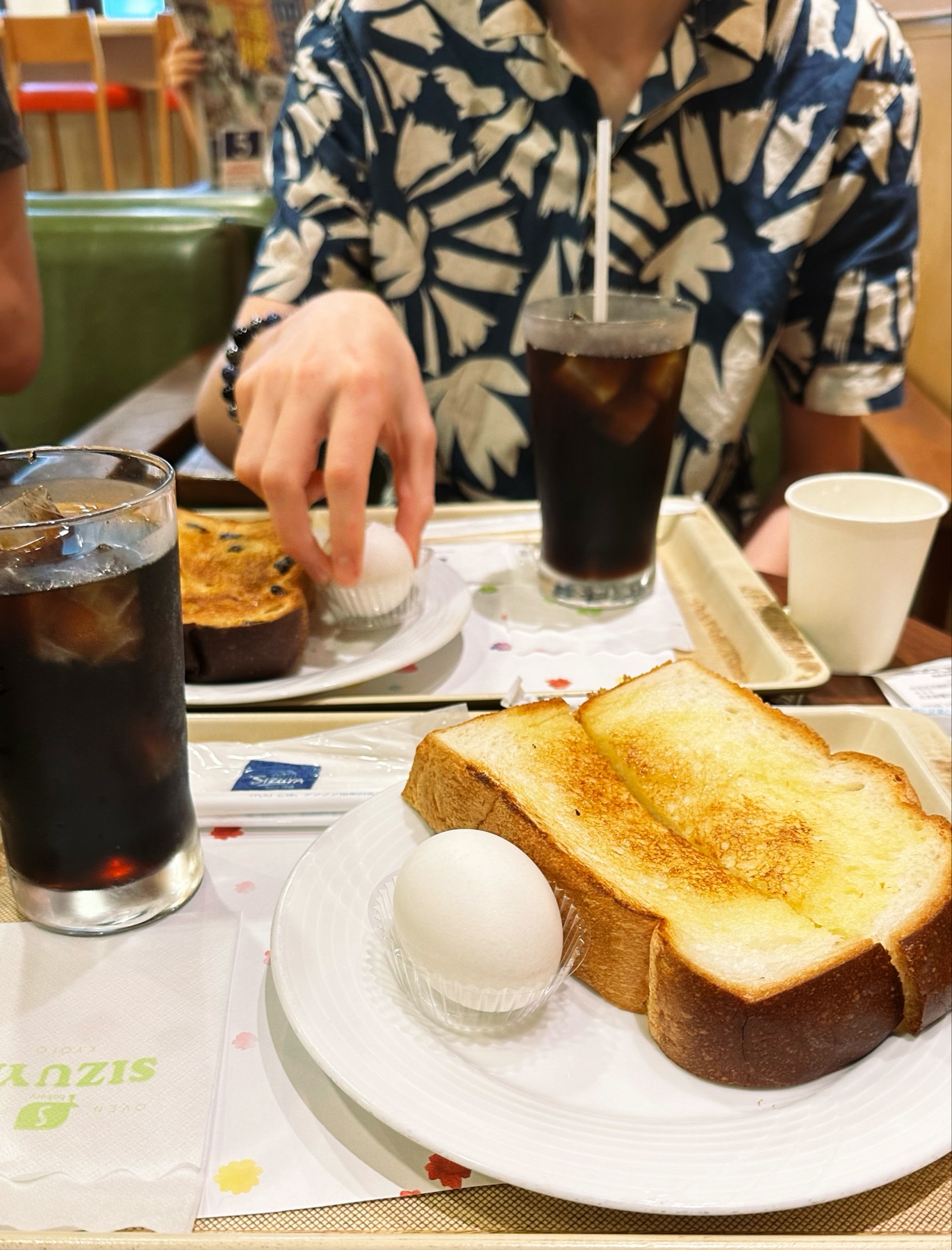 A breakfast plate with thick white toast and a hard boiled egg