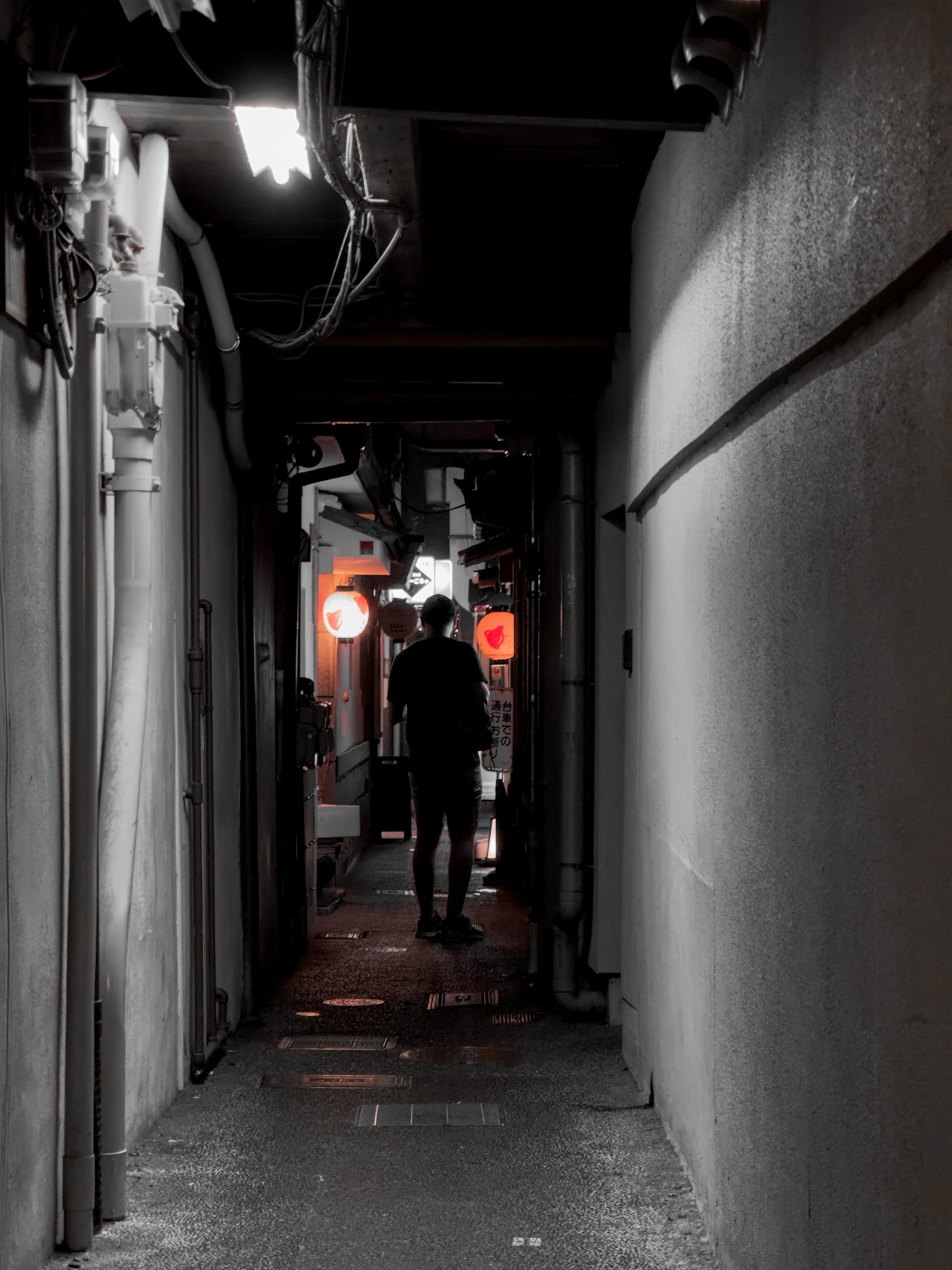One of the dark chidori alleyways with a silhouetted man at the end