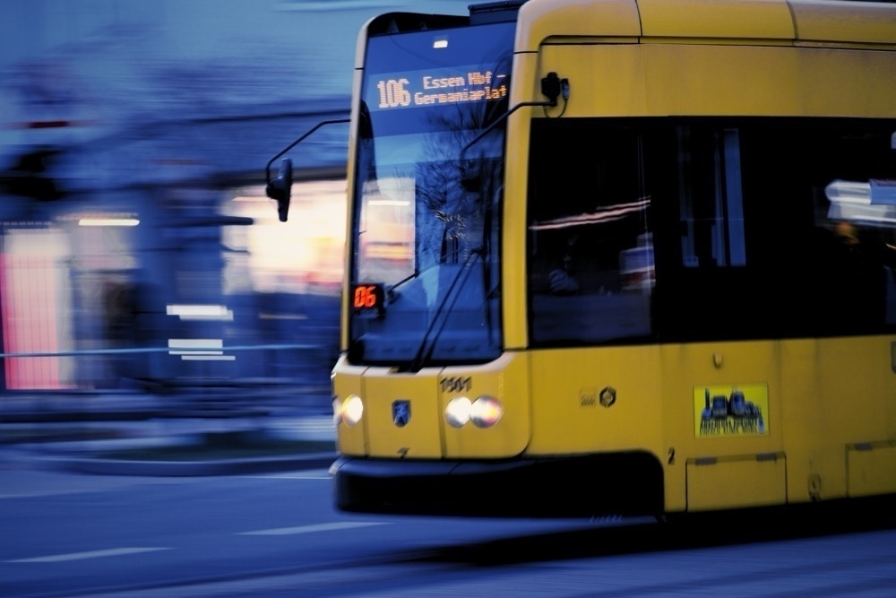 A driving tram. The background is motion-blurred. 