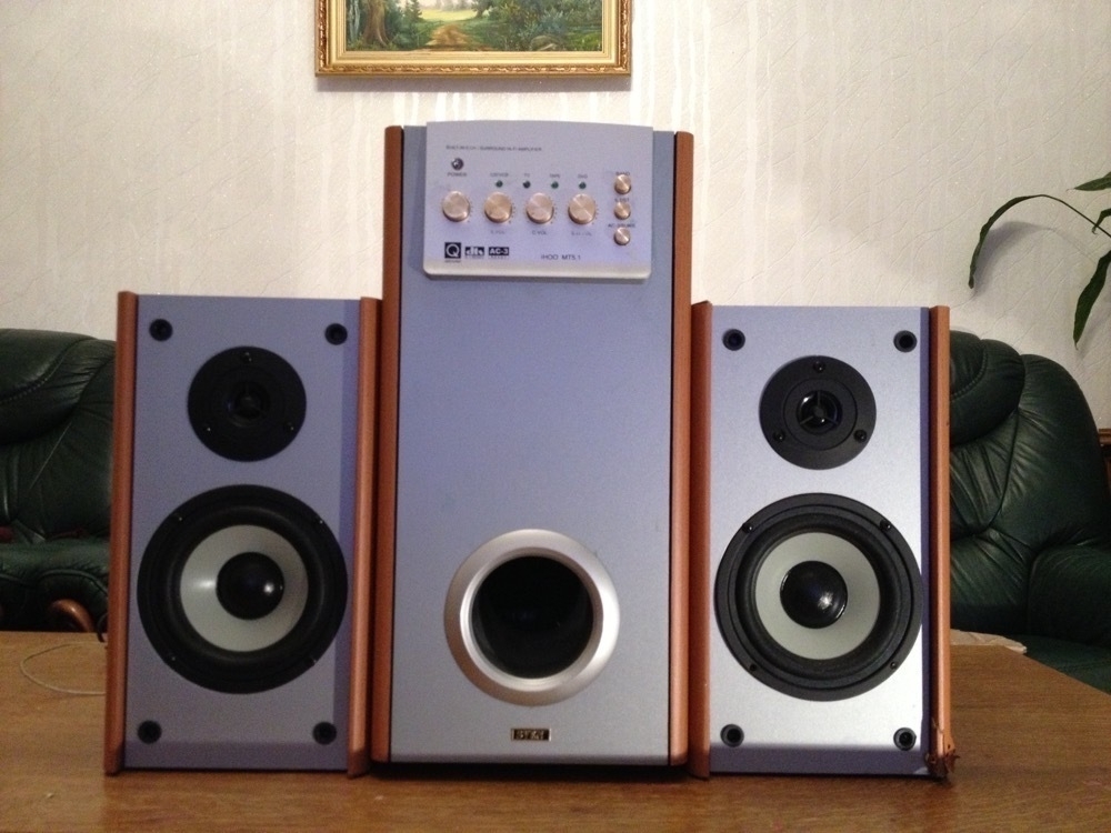 2 wooden speakers and subwoofer