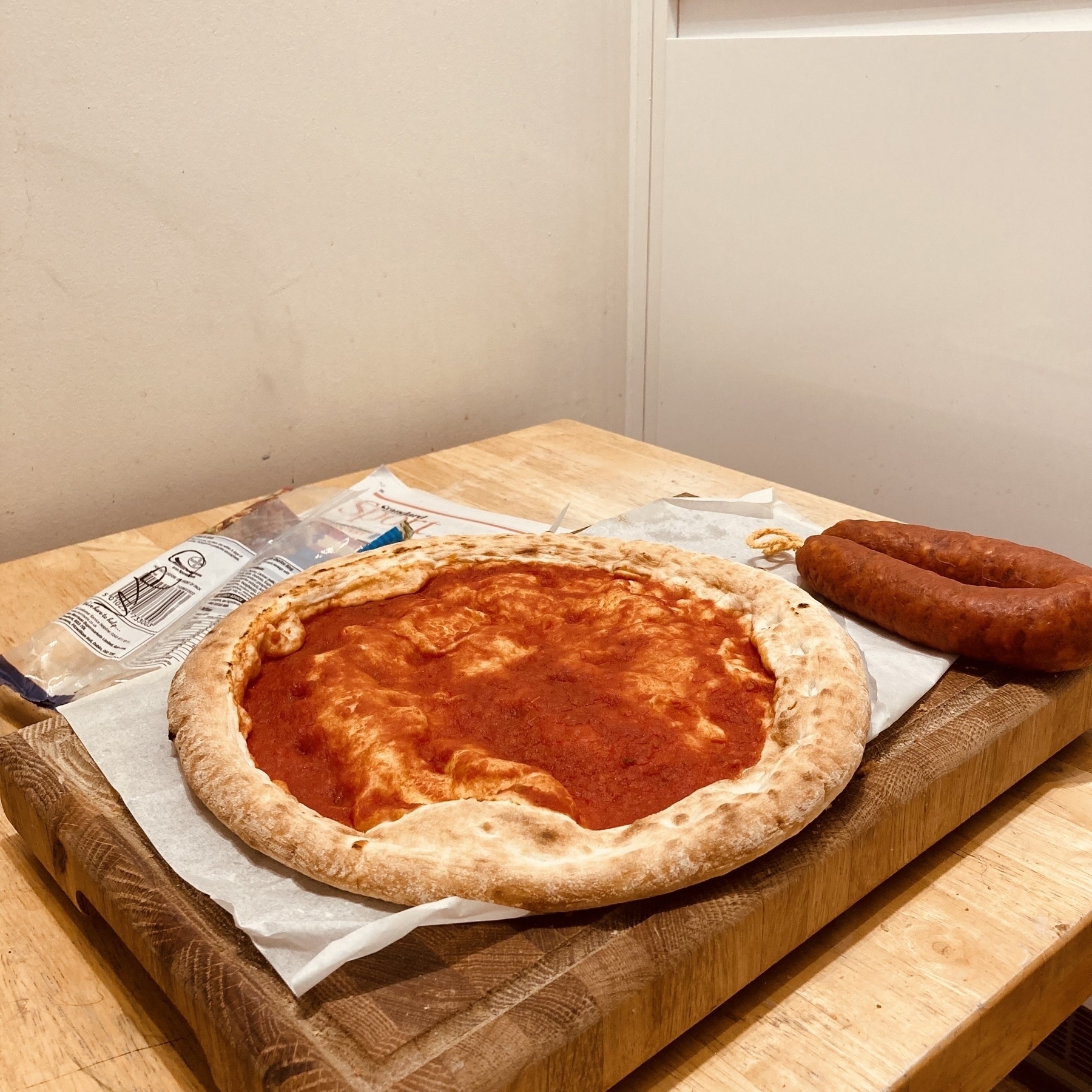 Pizza base and uncut Chorizo