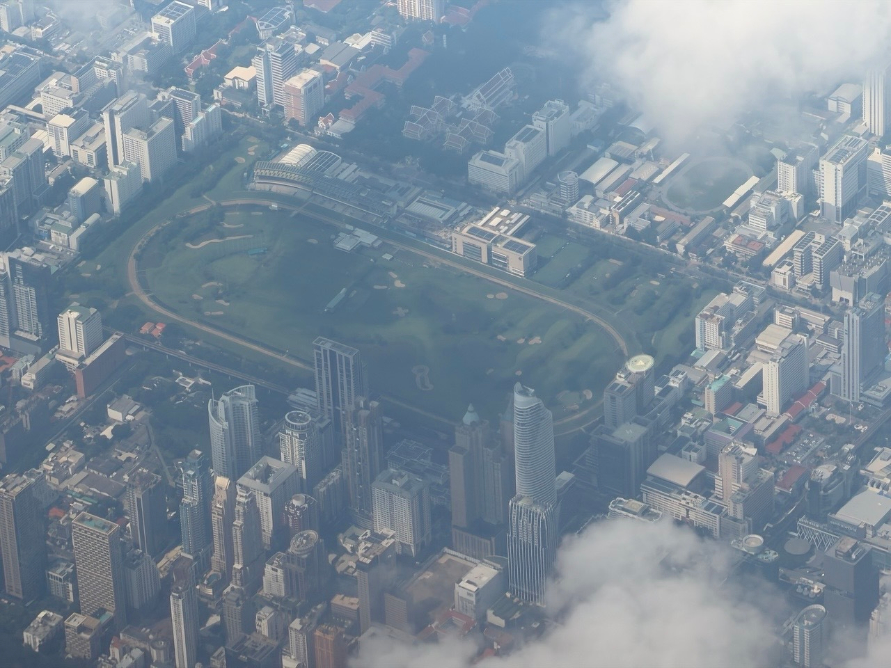 I was flying away from Bangkok today and noticed a green spot of grass. I love this shot so much; I had to be quick because t