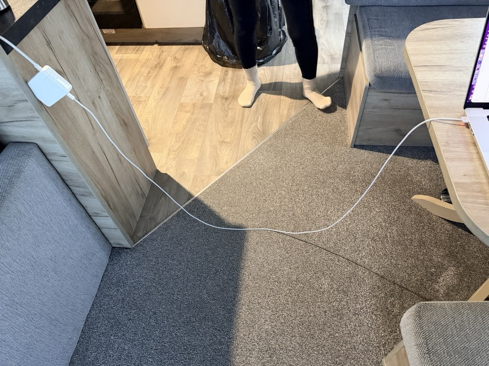MagSafe with a wire across kitchen isle and a table