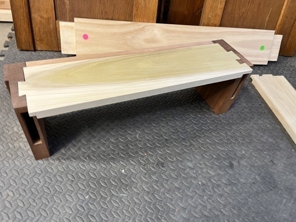 one completed base frame edge showing the dovetailed legs and floor