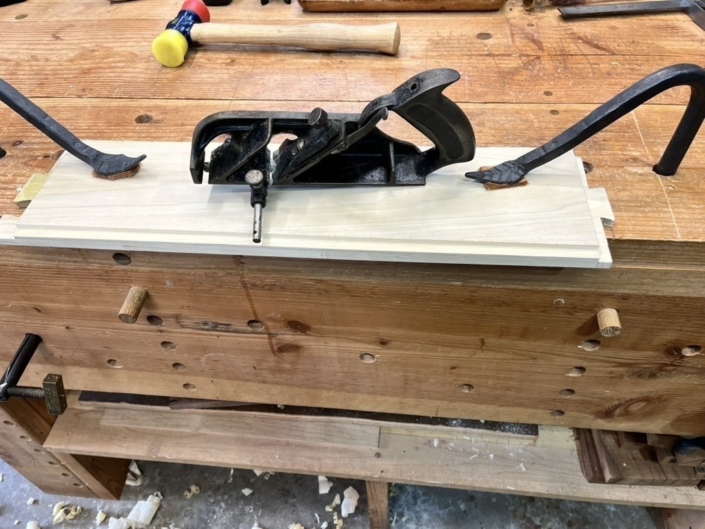 the underside of the dovetailed and grooved poplar showing the complex joinery