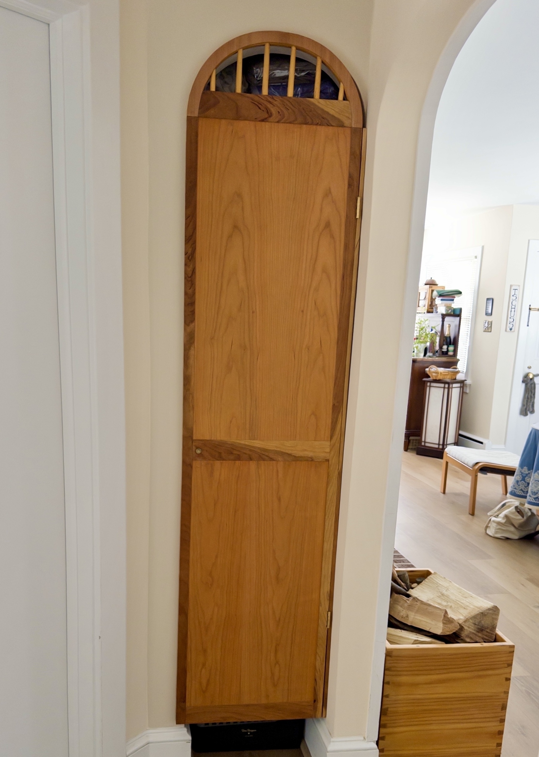 A handmade door covering up a narrow closet