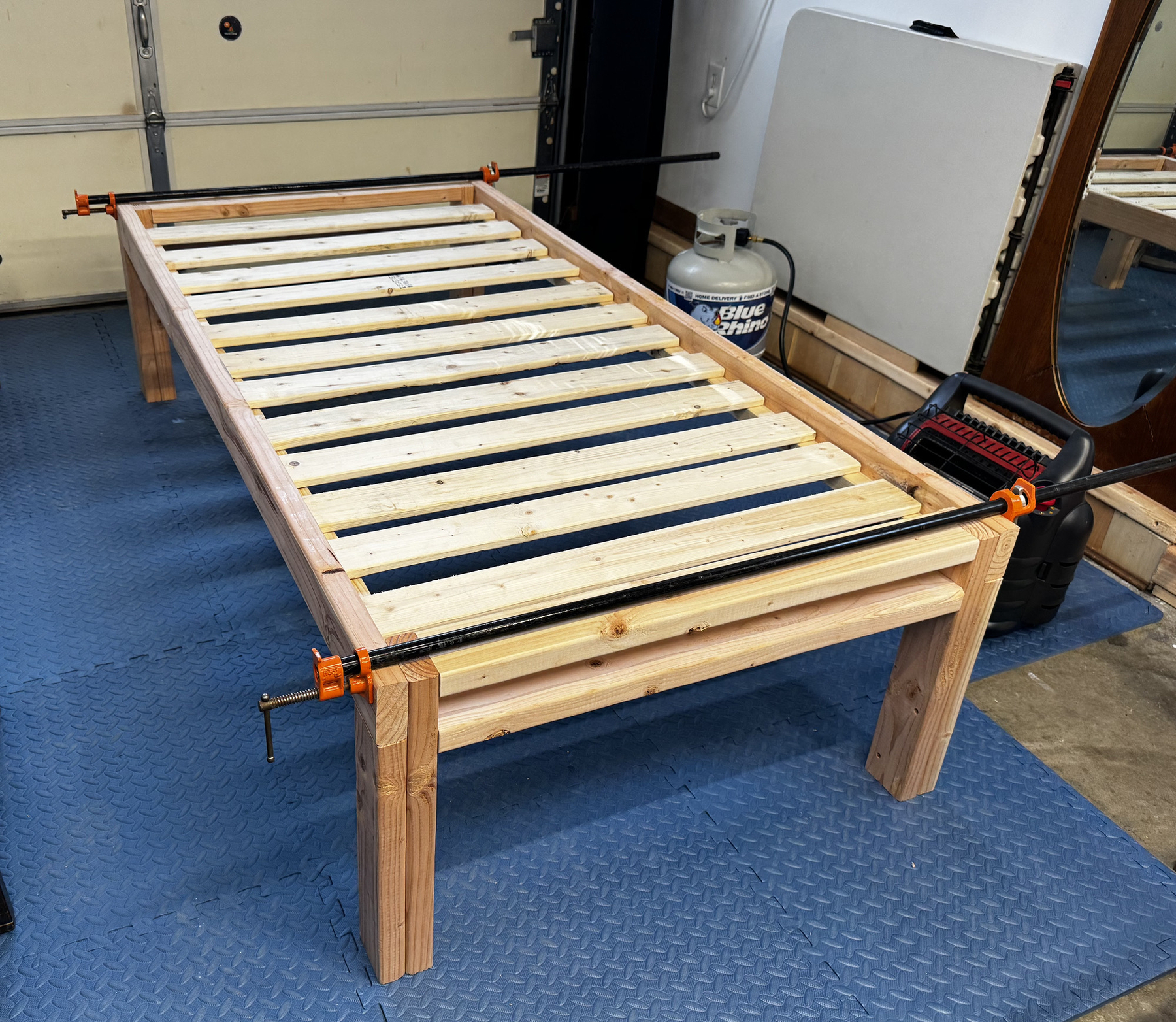 A bed frame for a tatami mat under construction, showing the slats