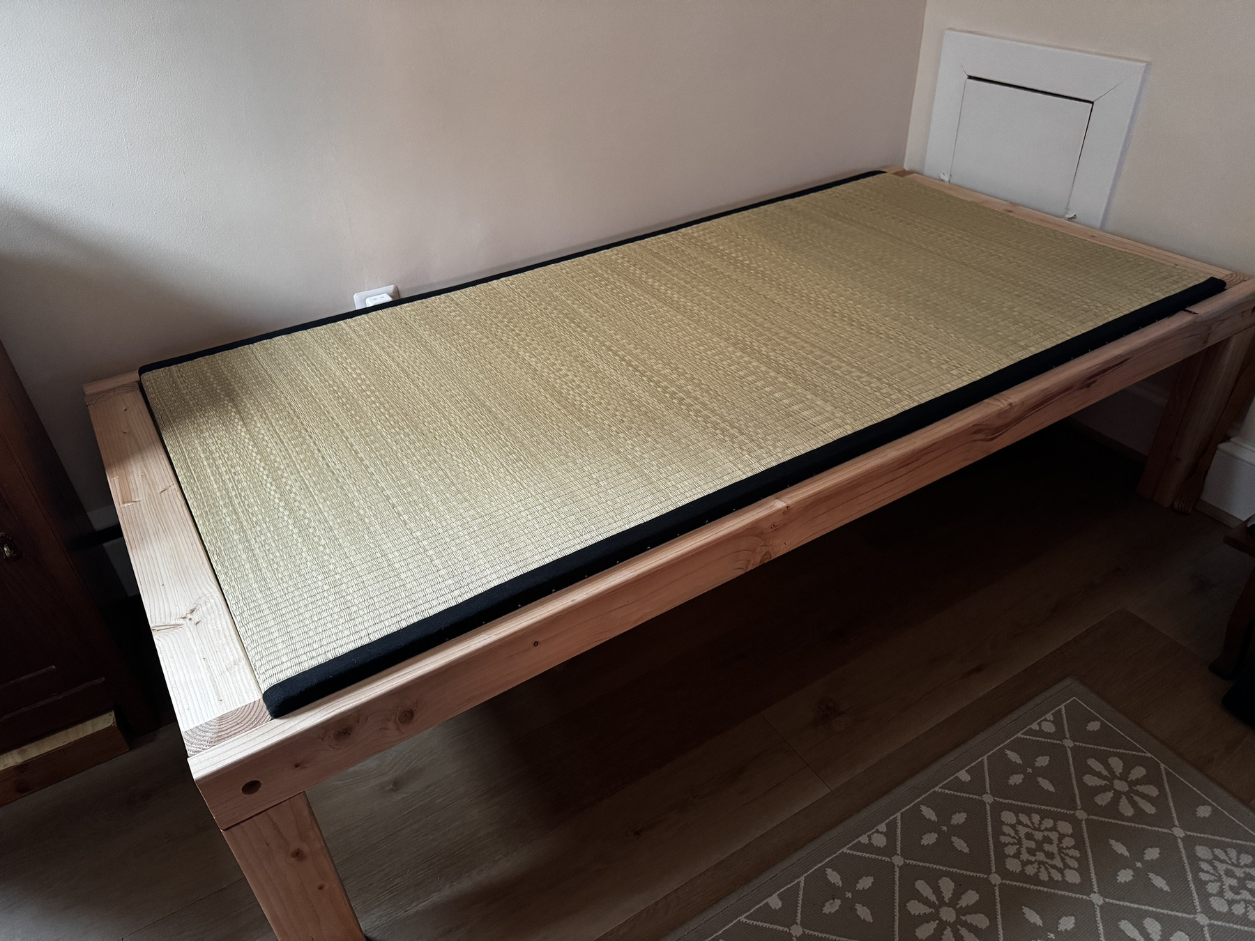 A bed frame made of two by four lumber for a tatami mat
