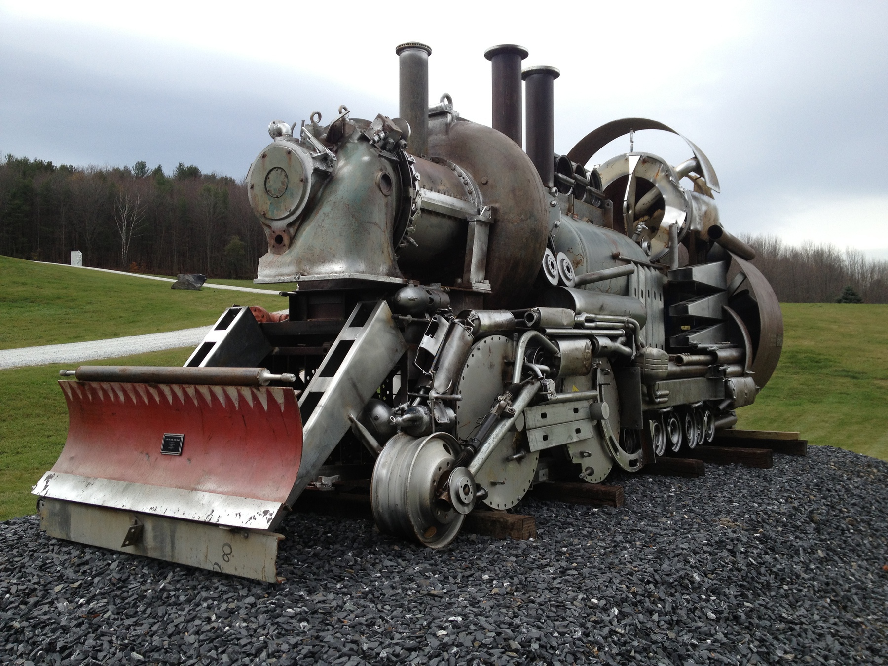 Front of train sculpture made out of random machine parts