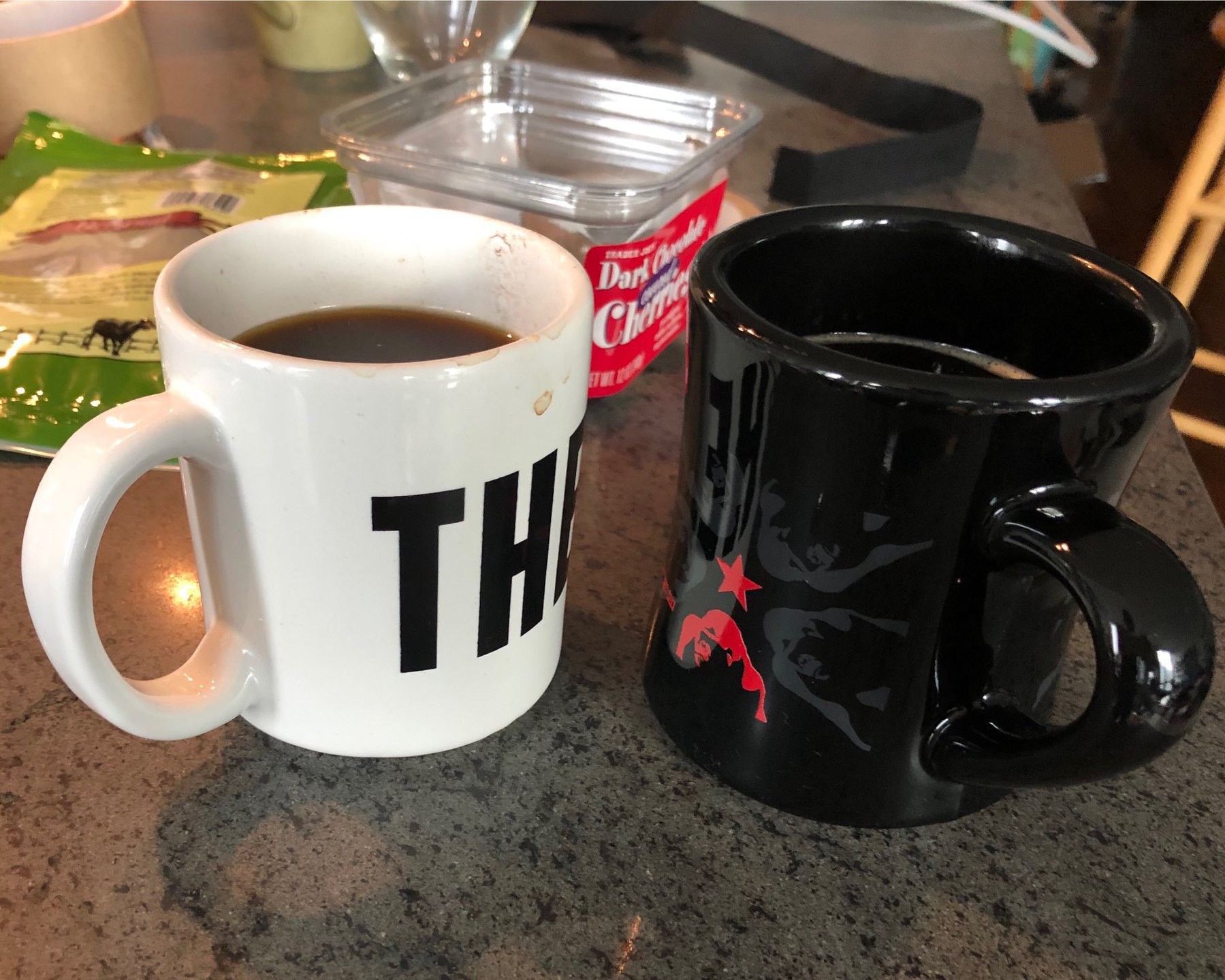 Two cups of black coffee.