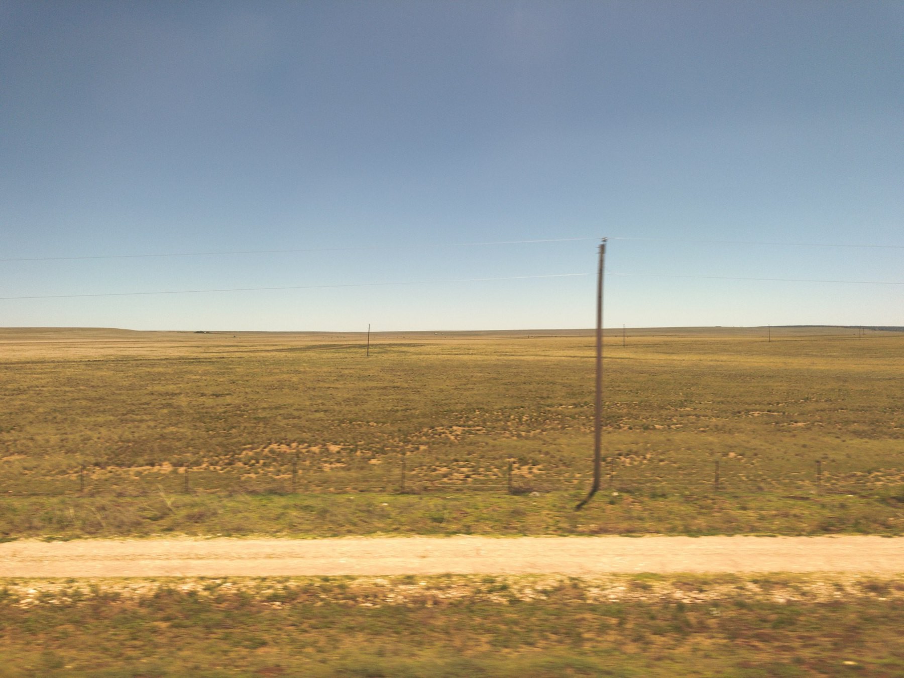 View of dry prairie from train window