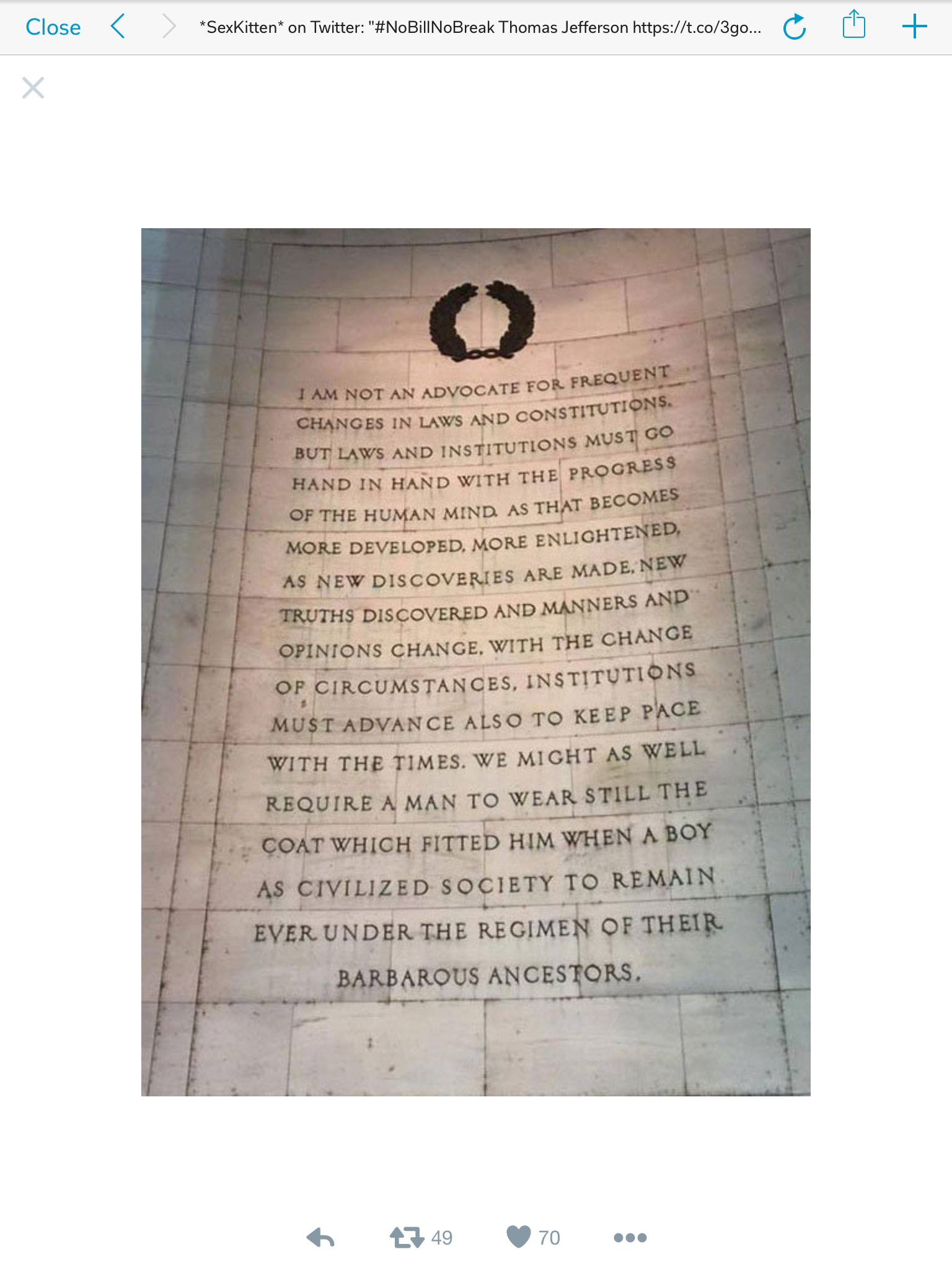 Text on a stone wall emphasizes the importance of evolving laws and institutions alongside human progress and enlightenment.