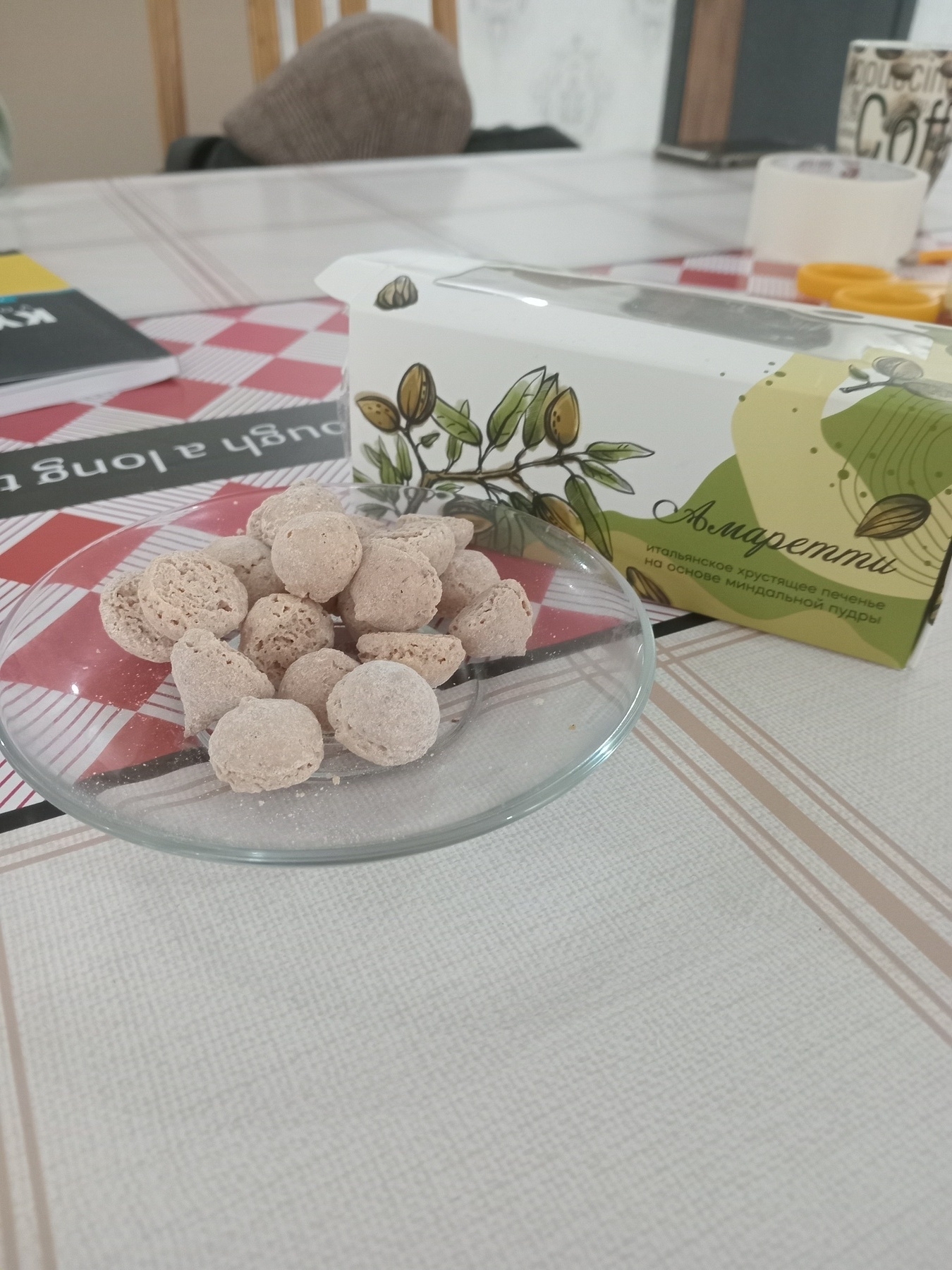 small light brown desserts in the shape of Hershey's kisses on a plate next to the box they were packaged in