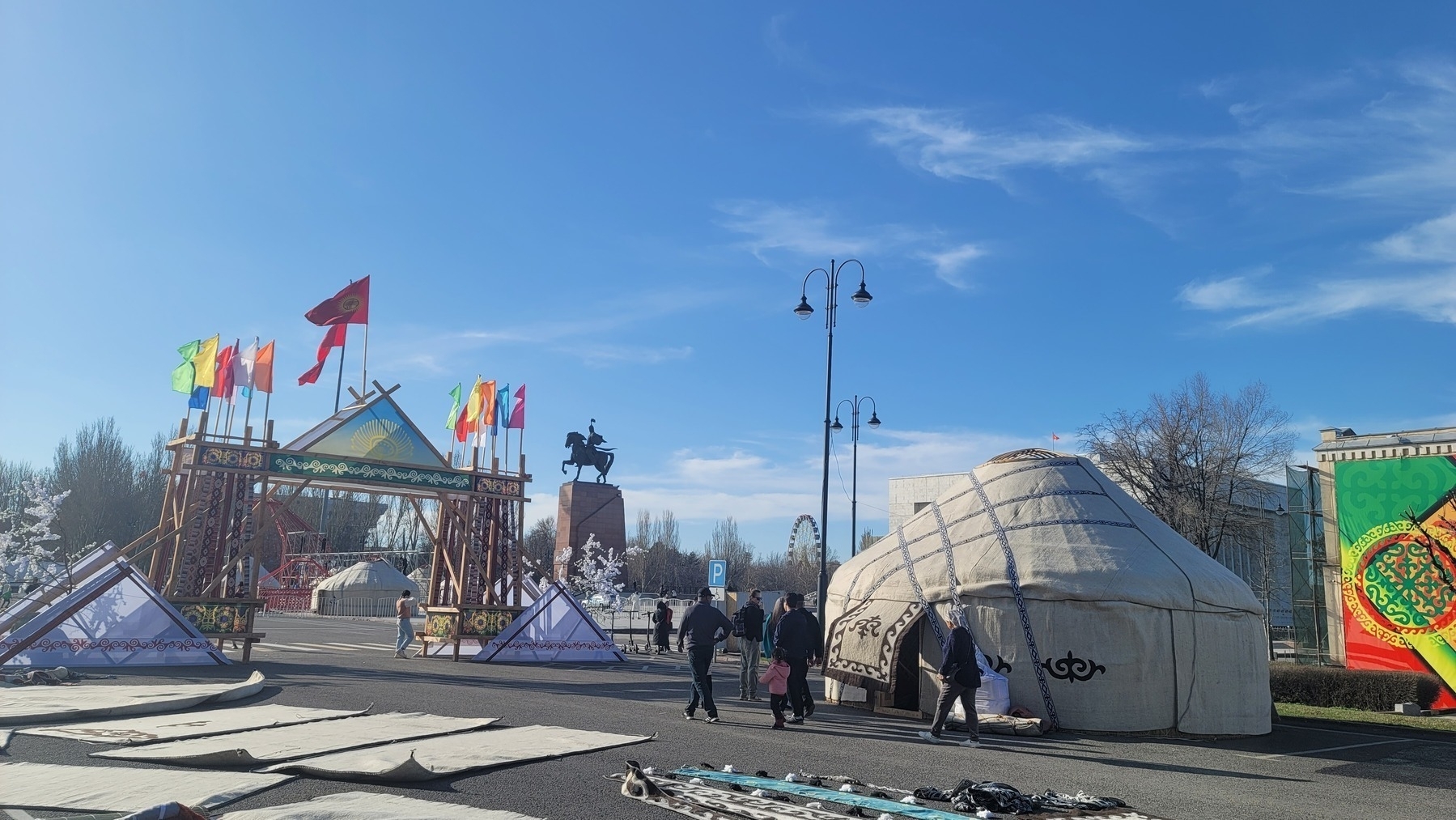 a few yurts and decorations set up by the iconic Manas statue at Ala-Too Square