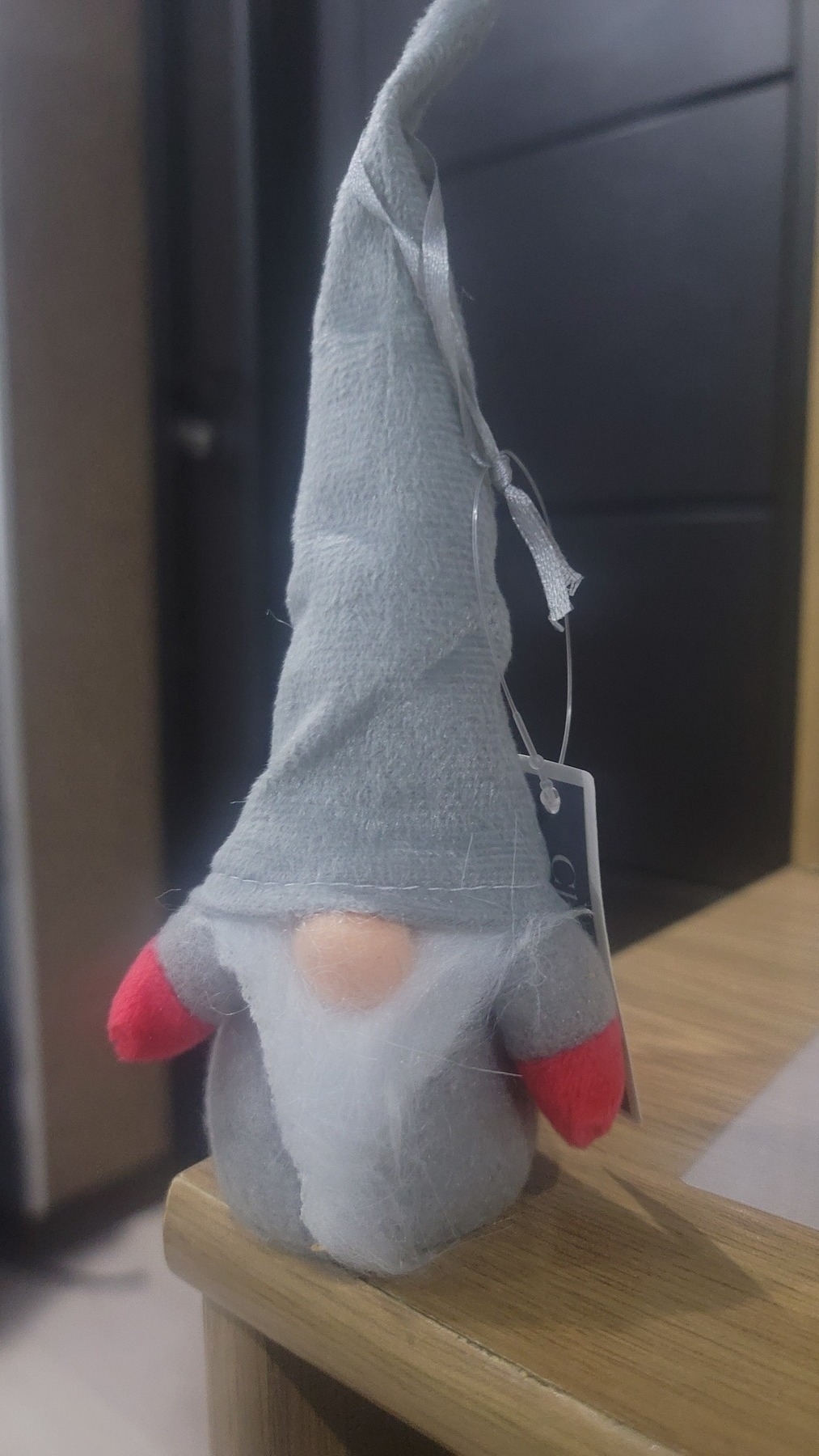 ornament of a gnome-looking man with a very tall hat made of styrofoam covered by fabric