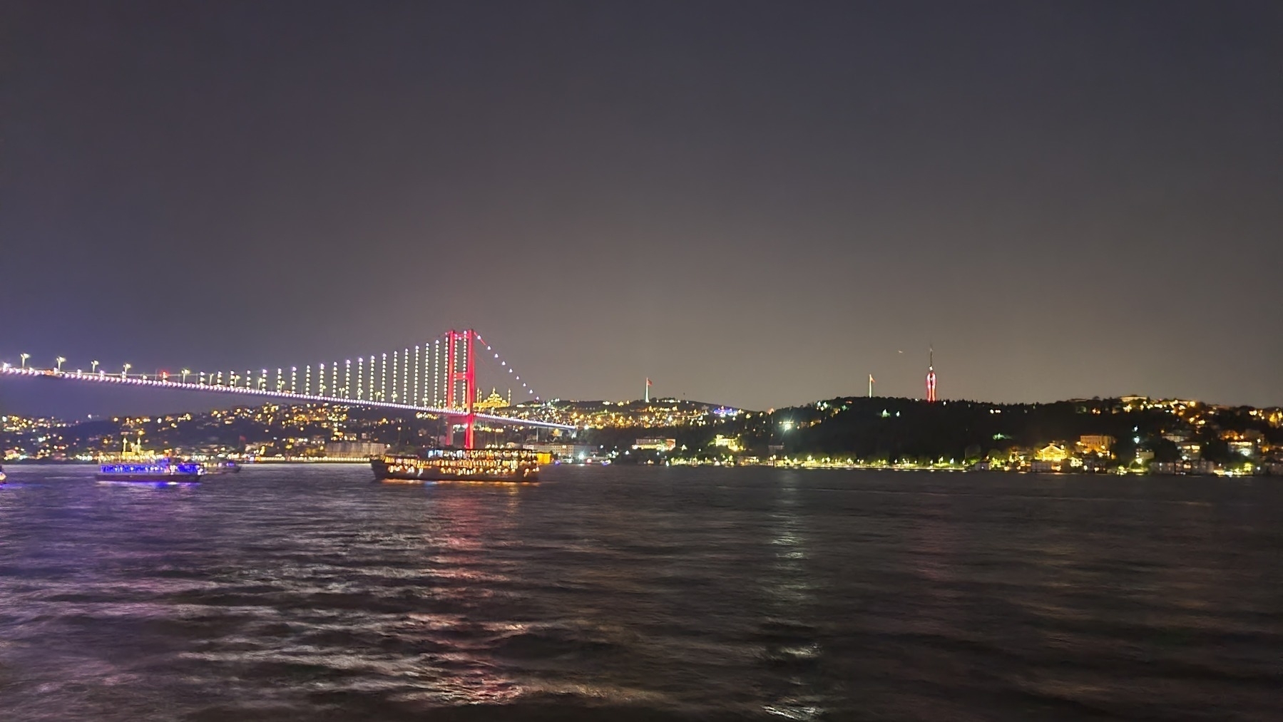 bridge across the sea to another part of Istanbul at night