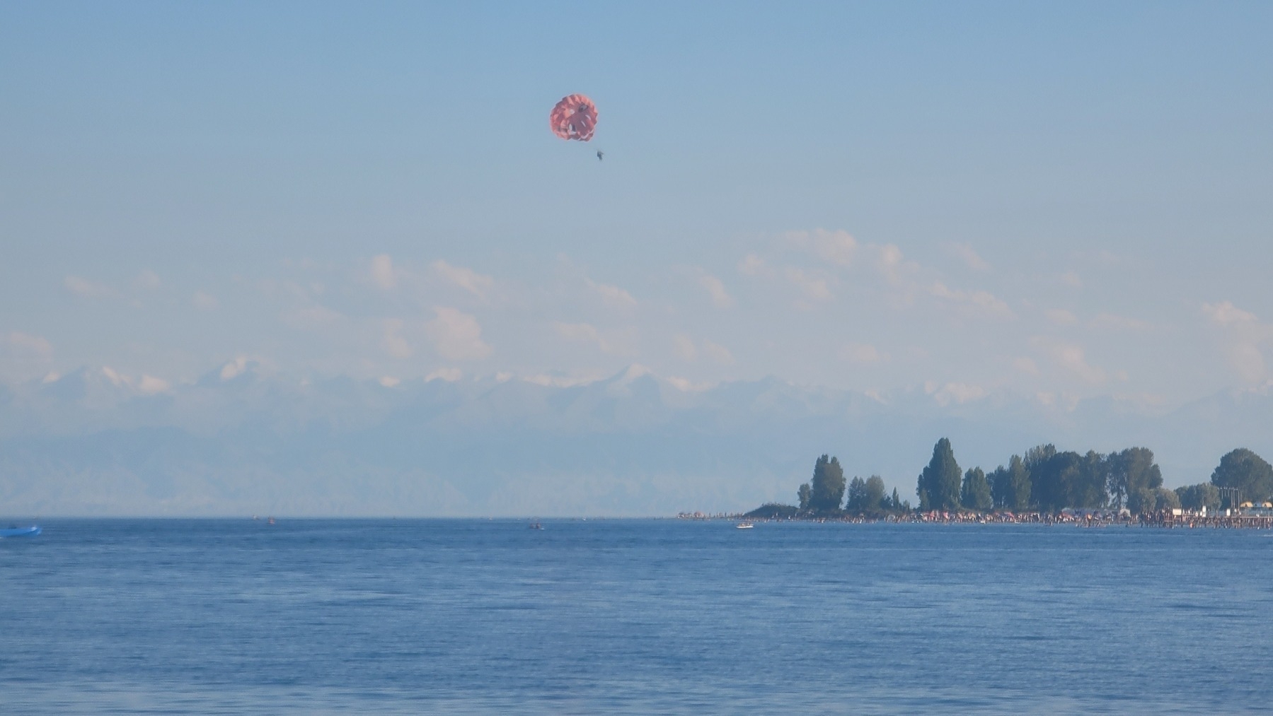 lake with barely visible mountains in the distance