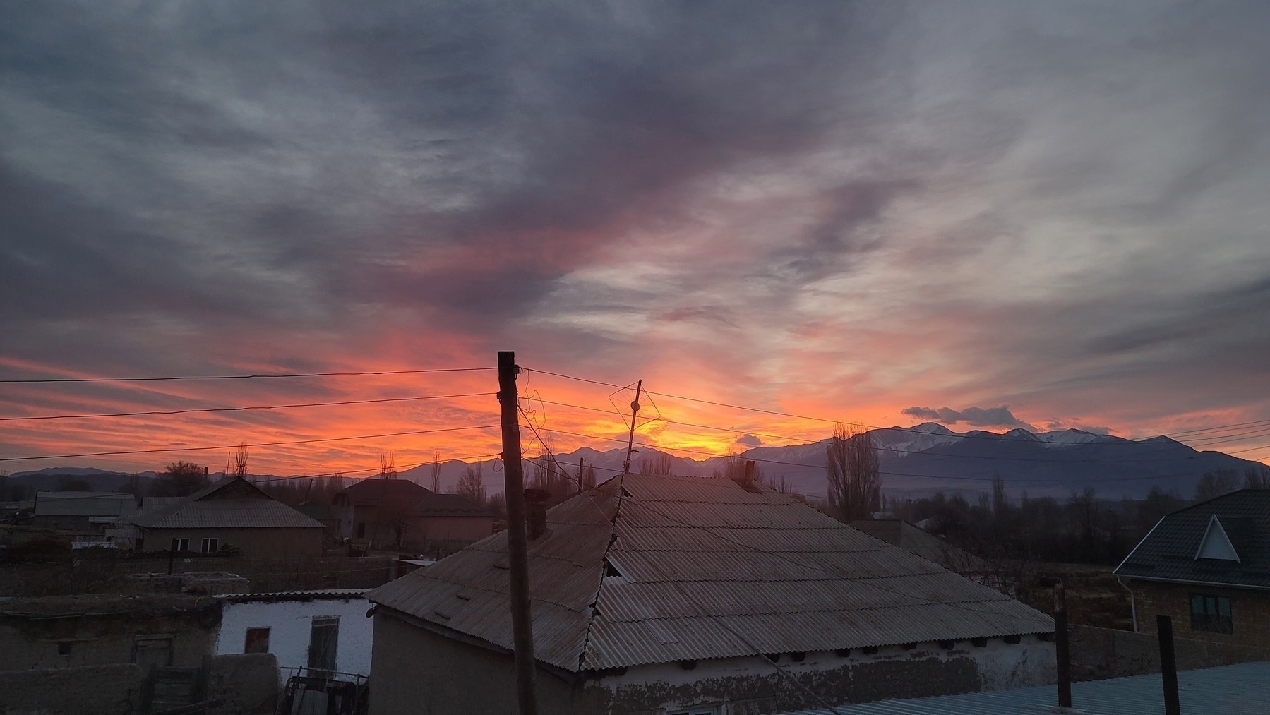 orange clouds near the horizon and gray clouds above