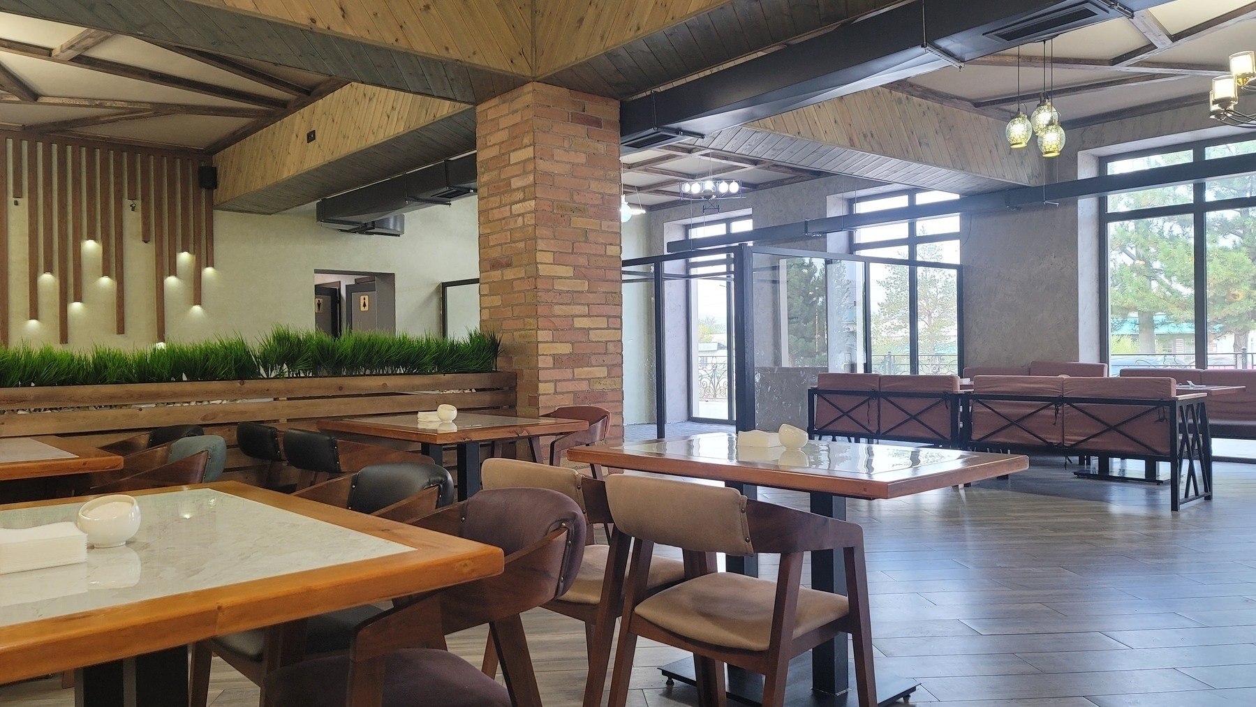 bright, open area in a restaurant with a few tables