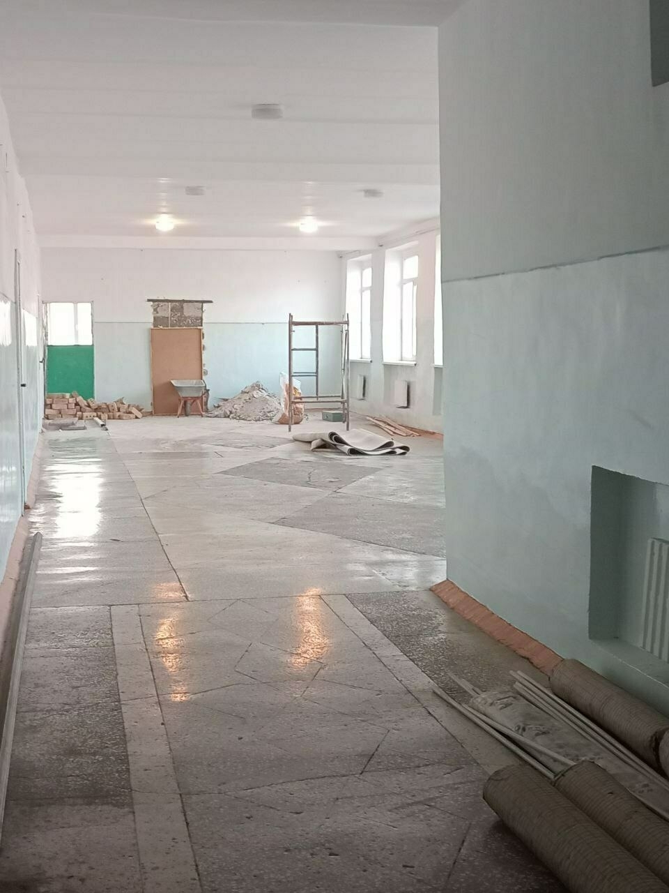 bricks and other building supplies in a school hall