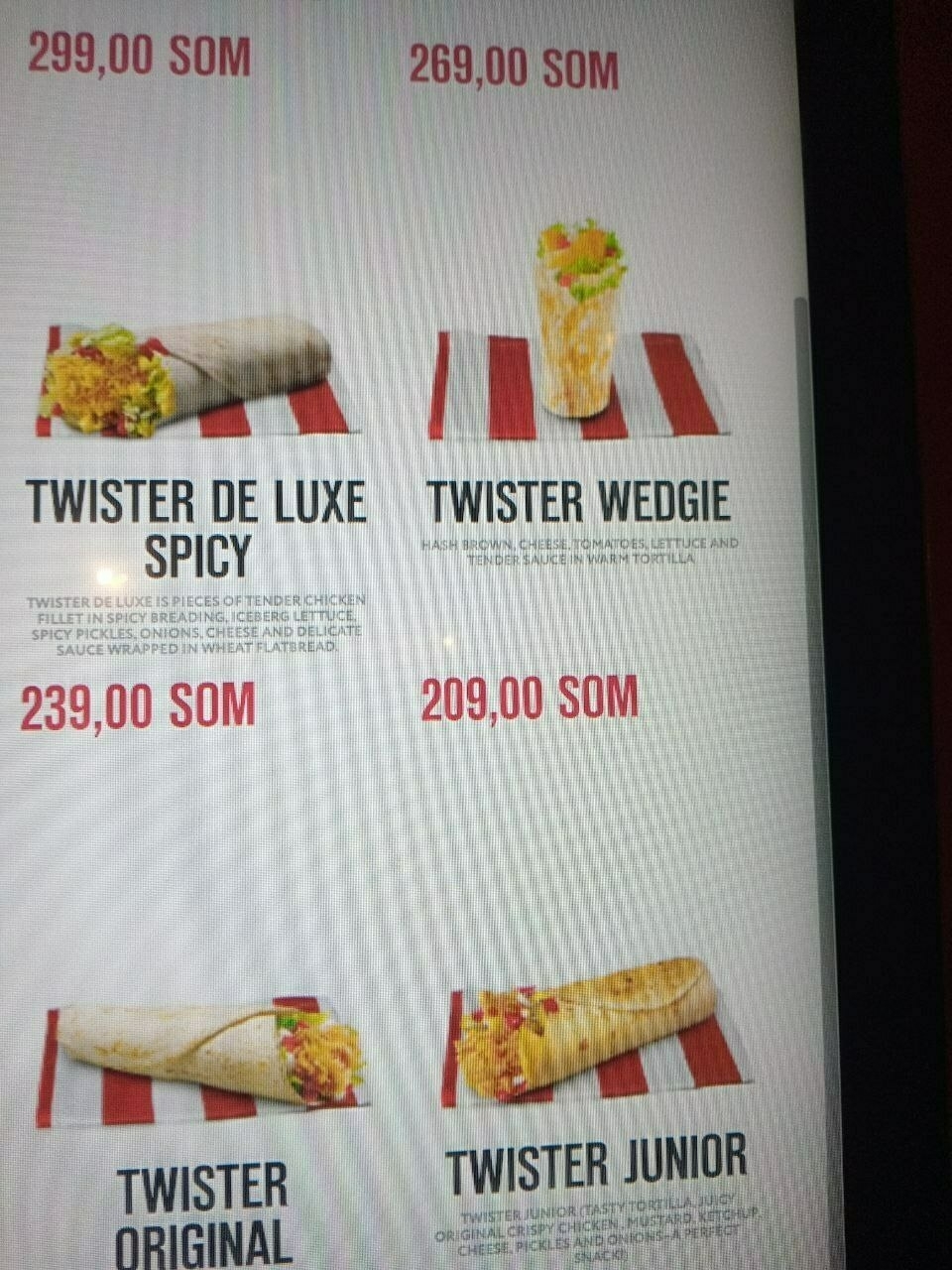 4 items on a screen at a KFC kiosk with one of them named "twister wedgie"