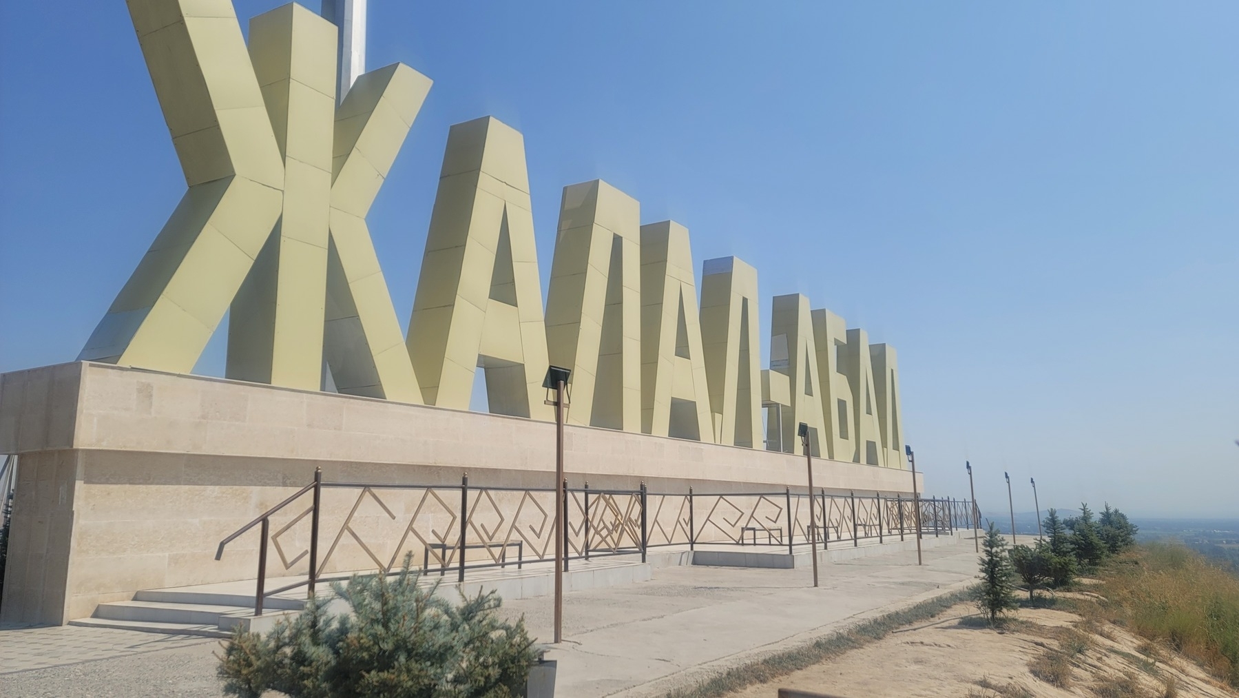 tall Cyrillic letters spelling out Jalal-Abad 