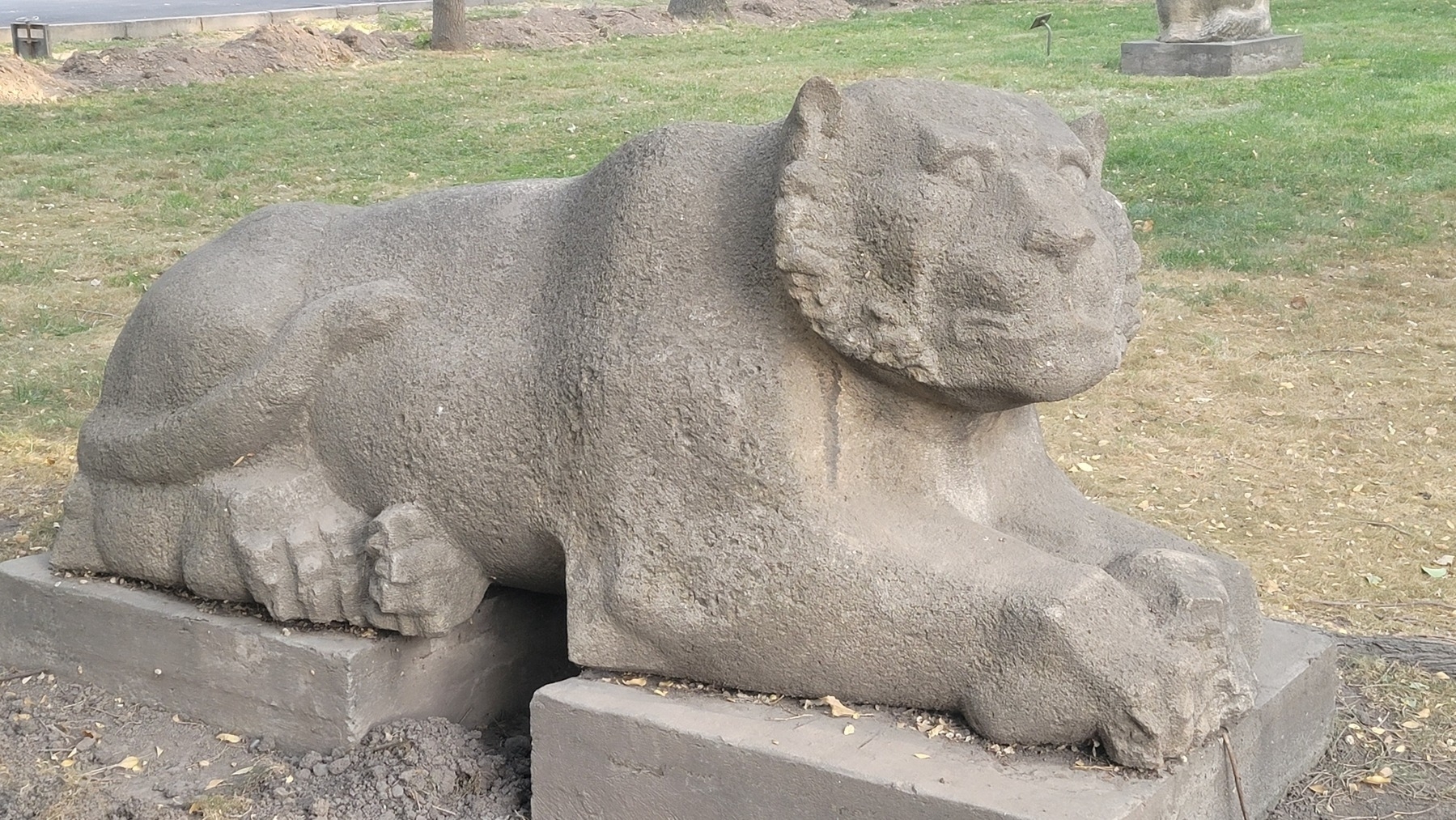 statue of a big cat, probably meant to be a snow leopard because those live in Kyrgyzstan 