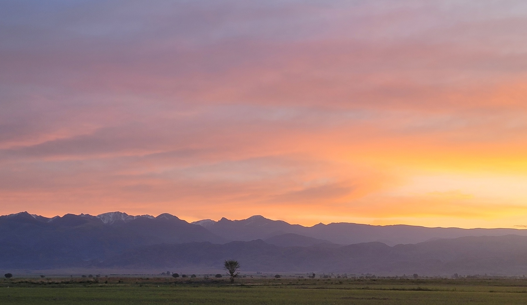 sunrise behind mountains