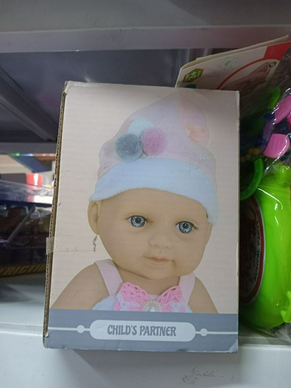 box with a close-up picture of a baby doll's face