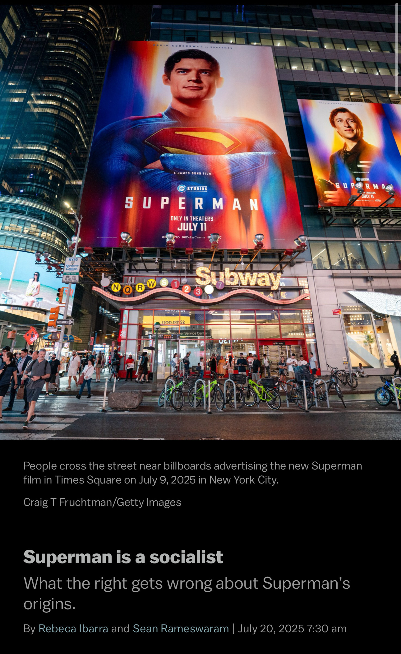 Billboards in Times Square feature advertisements for the new Superman film as people walk below.