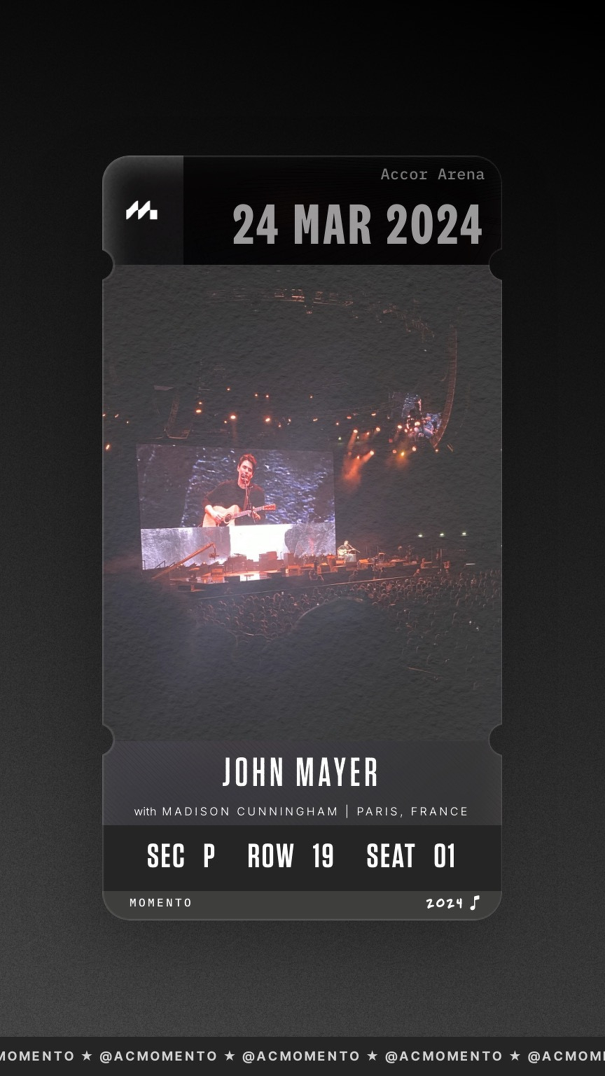 A concert ticket design for John Mayer's performance in Paris, France on March 24, 2024, featuring a stage with a musician performing to a large audience.