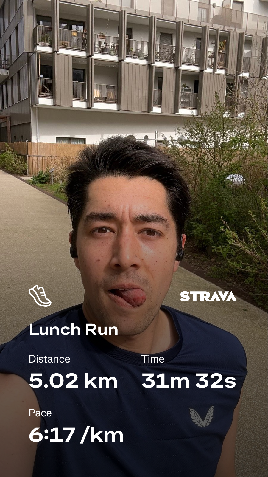 A person is on a run outdoors, using the Strava app to track a 5.02 km distance with a pace of 6:17 per km, taking 31 minutes and 32 seconds.