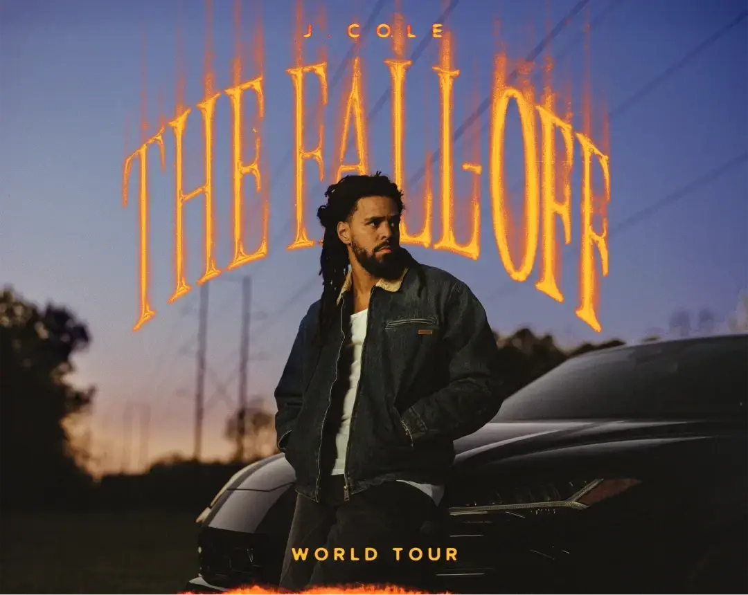 A man stands next to a car under a sky, with bold text above and below announcing The Fall Off world tour and the artist's name, J. Cole.