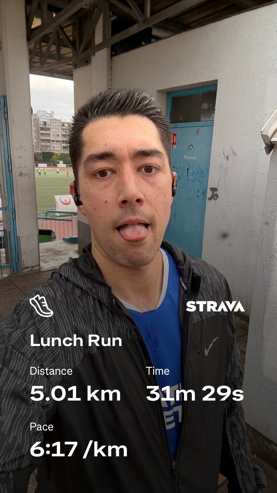 A person is taking a post-run selfie with running statistics, including distance, time, and pace, displayed on the image.