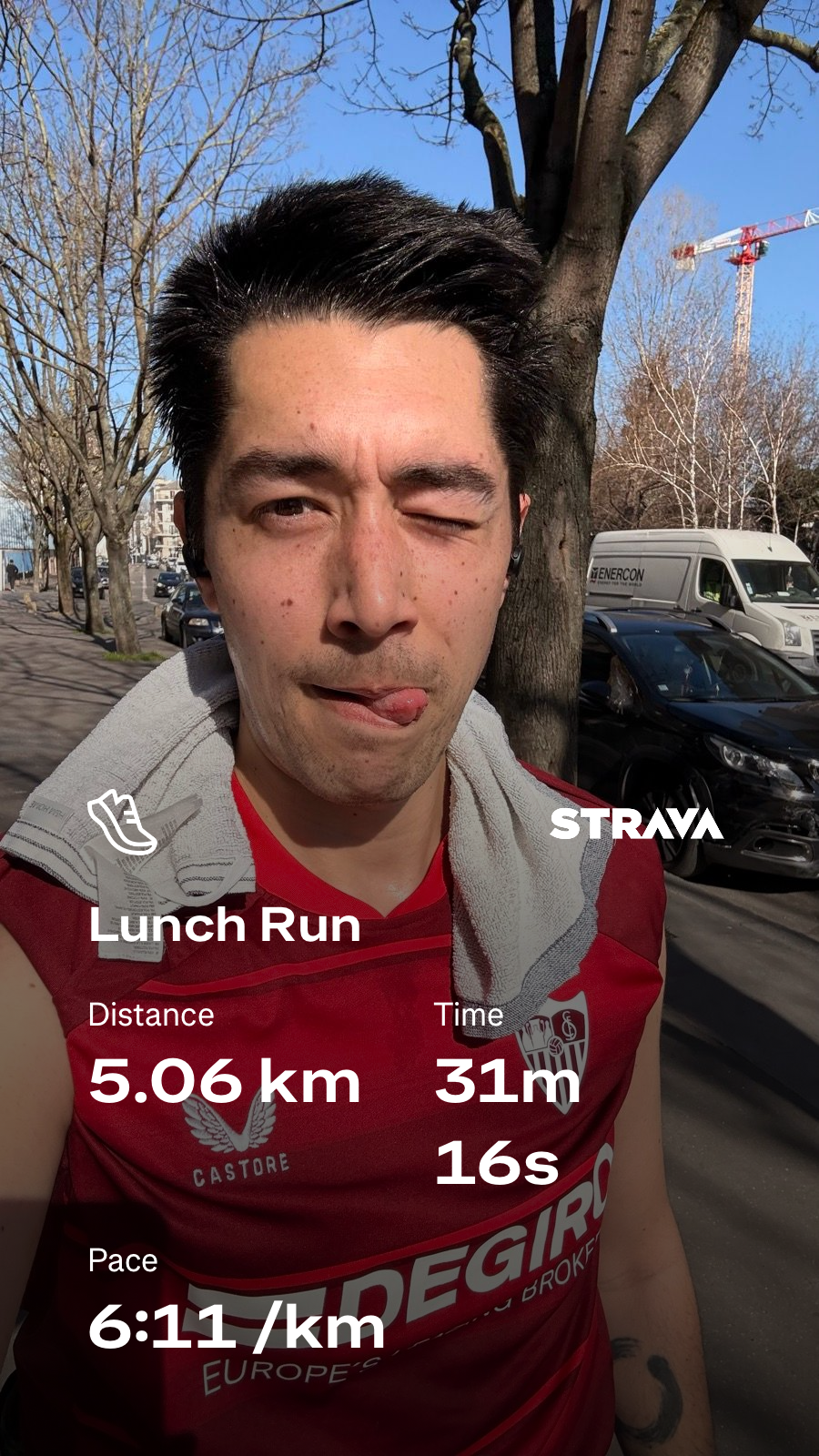 A person with a towel over their shoulder is taking a selfie while running, displaying workout statistics from a running app on the image.