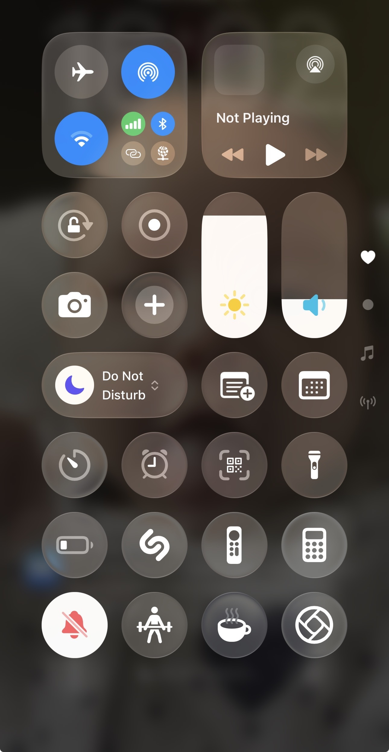Auto-generated description: The image shows a screenshot of an iOS Control Center with various settings and controls, including Wi-Fi, Bluetooth, brightness, and volume.