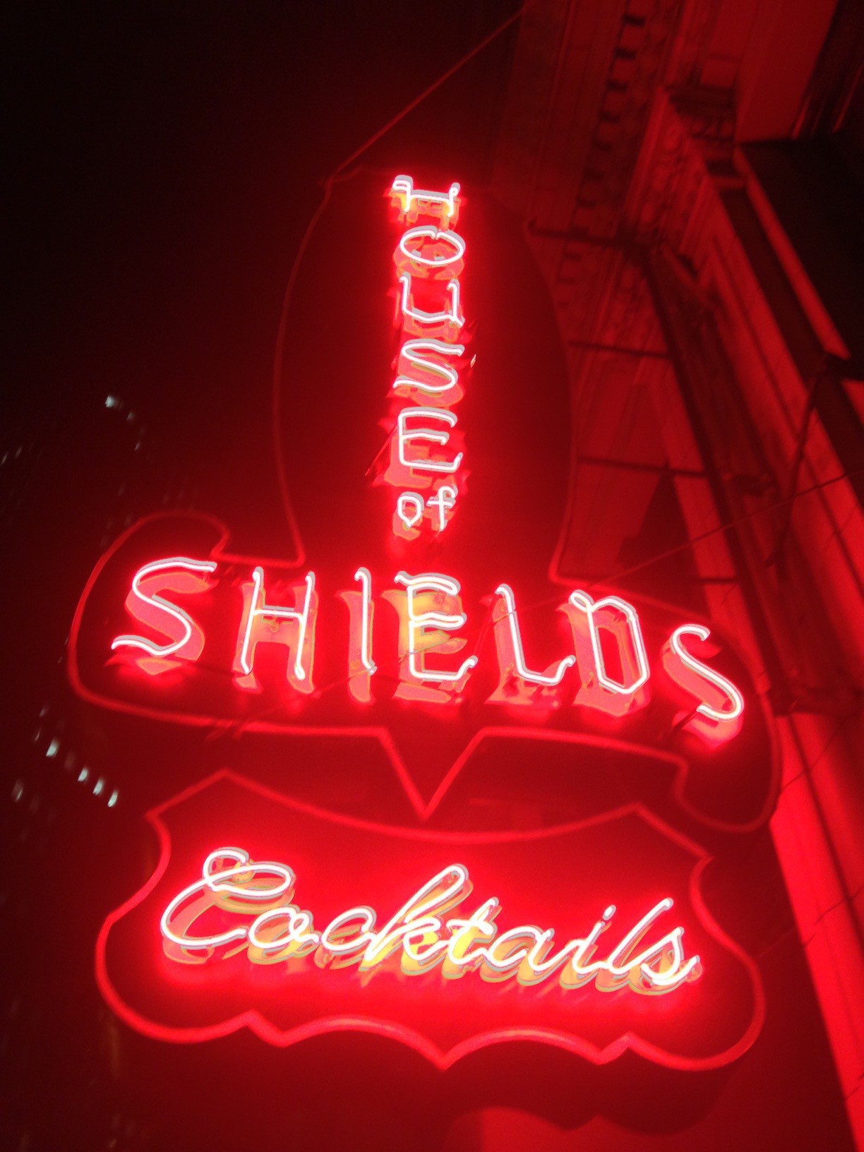 The neon sign out front of the House of Shields