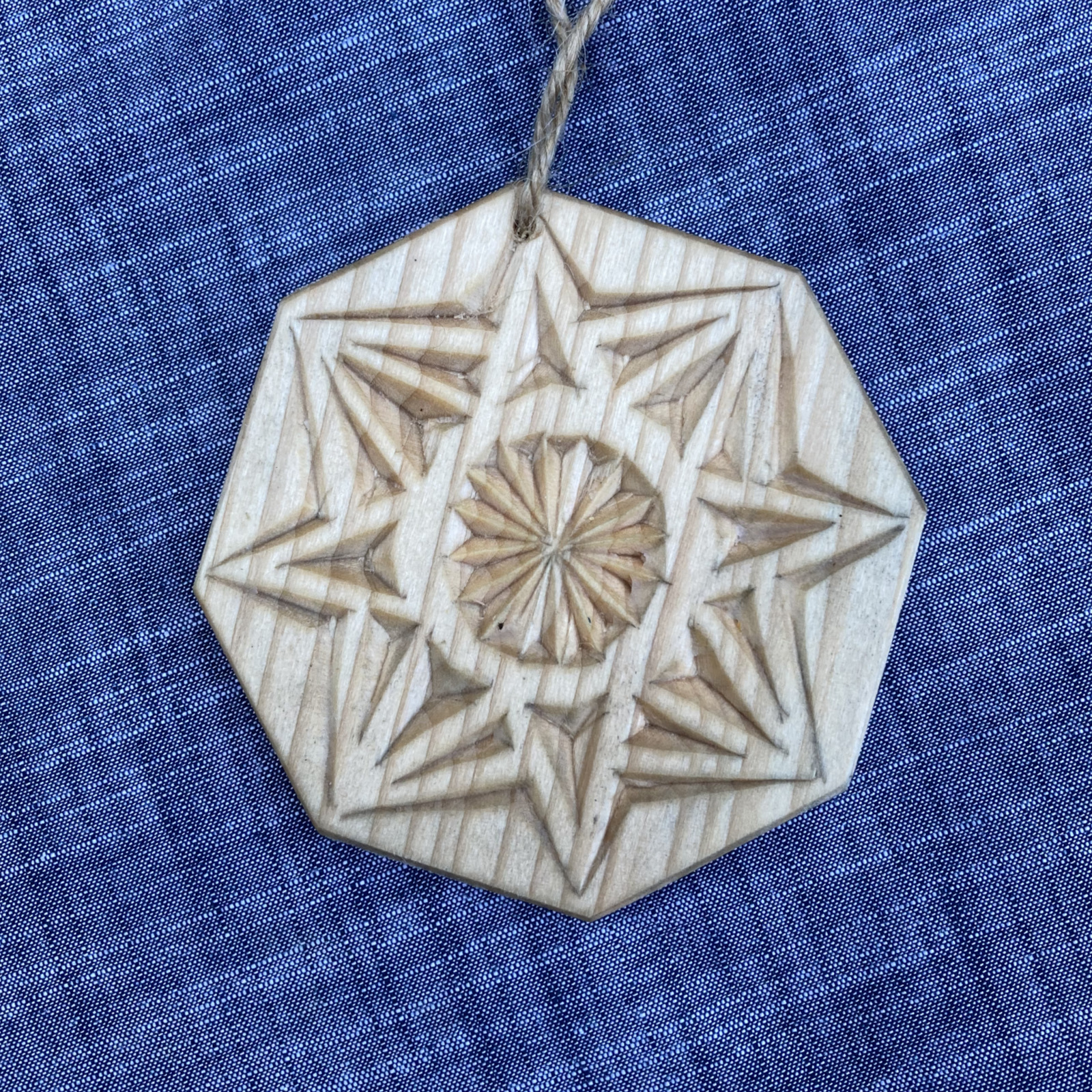 chip-carved tree ornament with eight-point star pattern