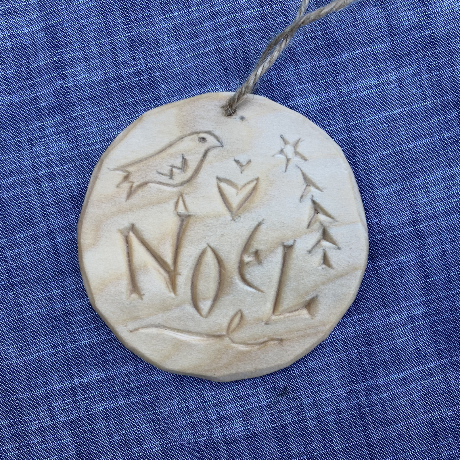 chip-carved tree ornament with legend Noel, tree, bird, hearts