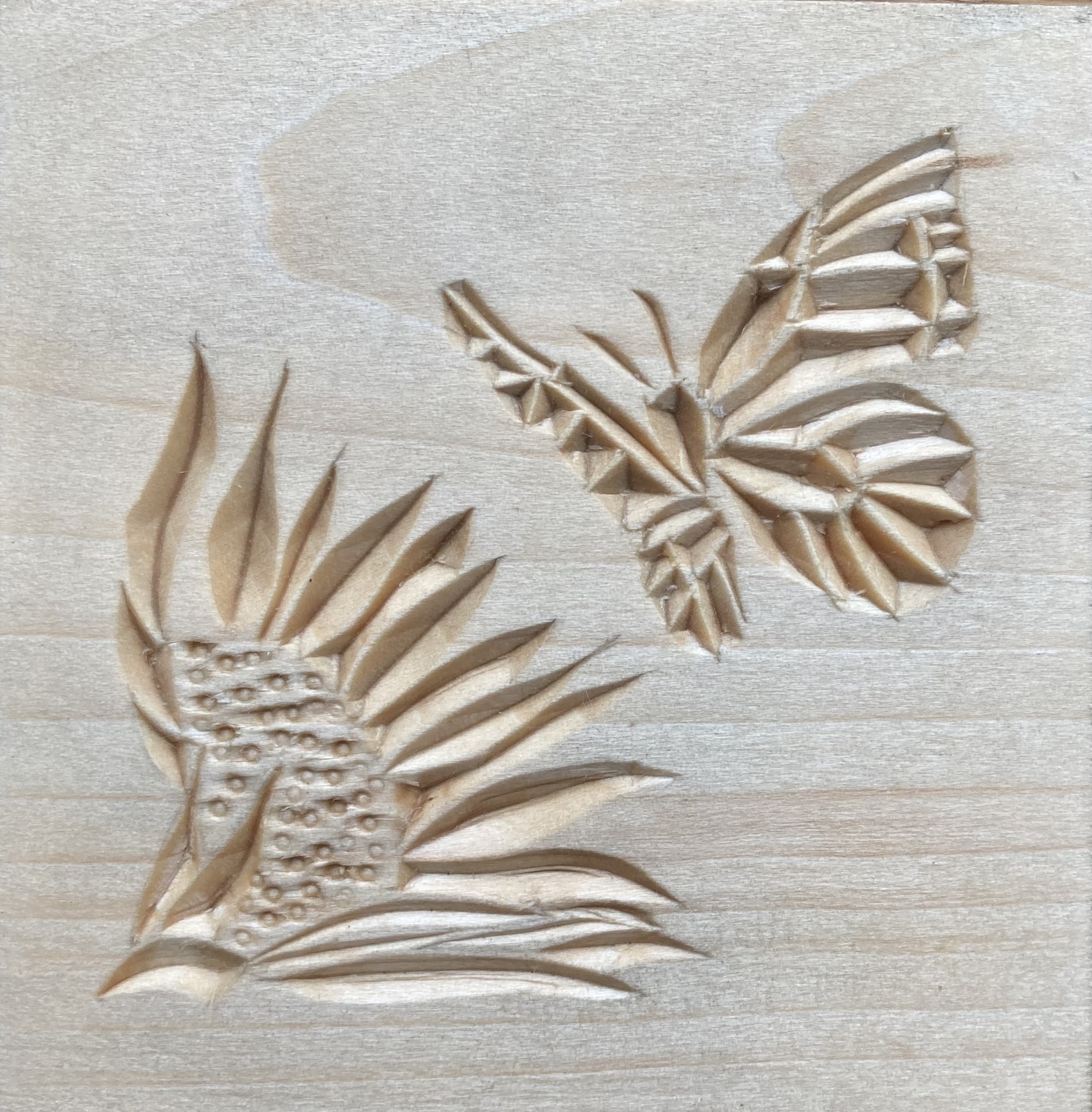 chip carving of butterly and sunflower