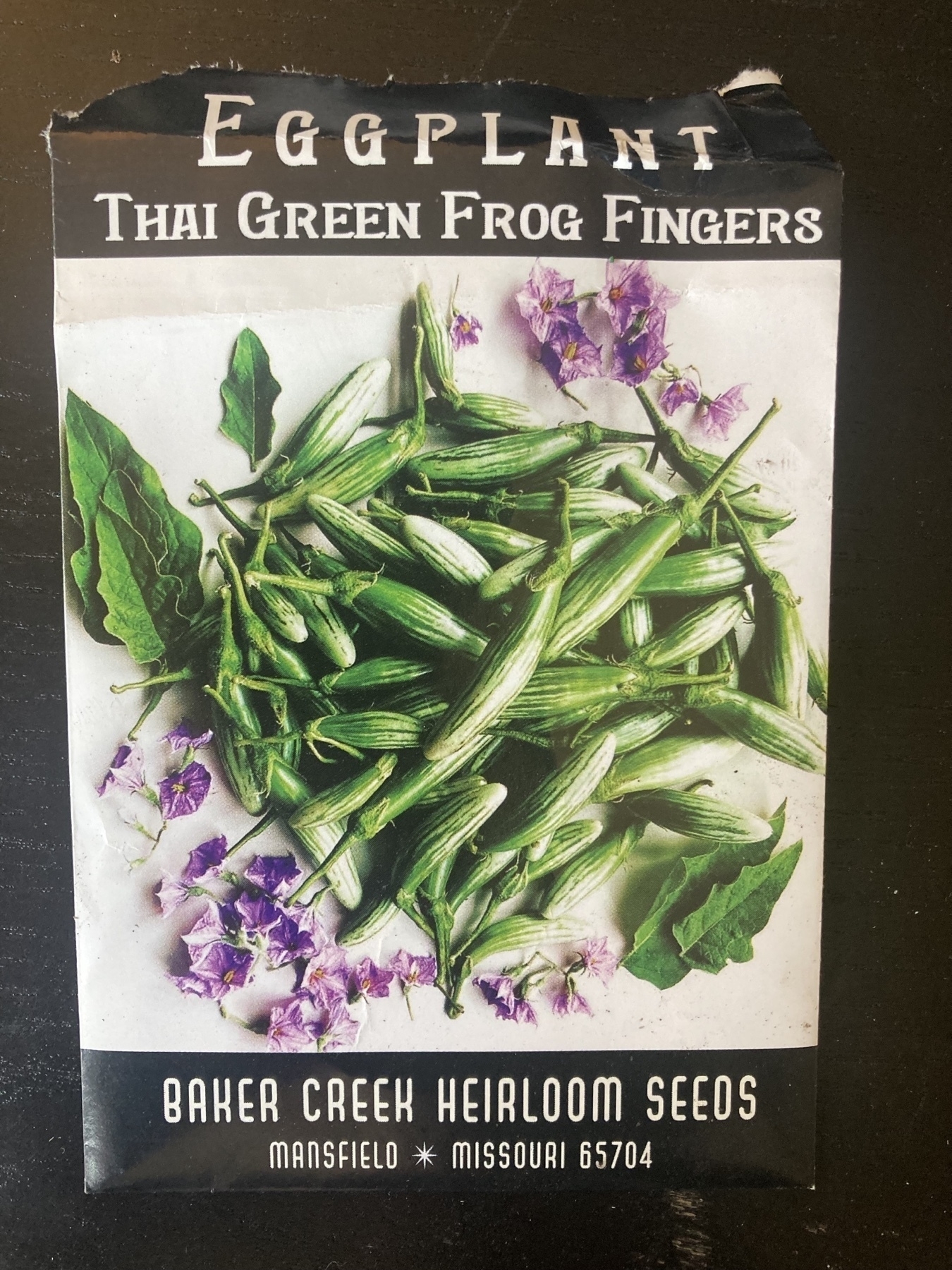 packet of seeds labeled Eggplant: Thai Green Frog Fingers