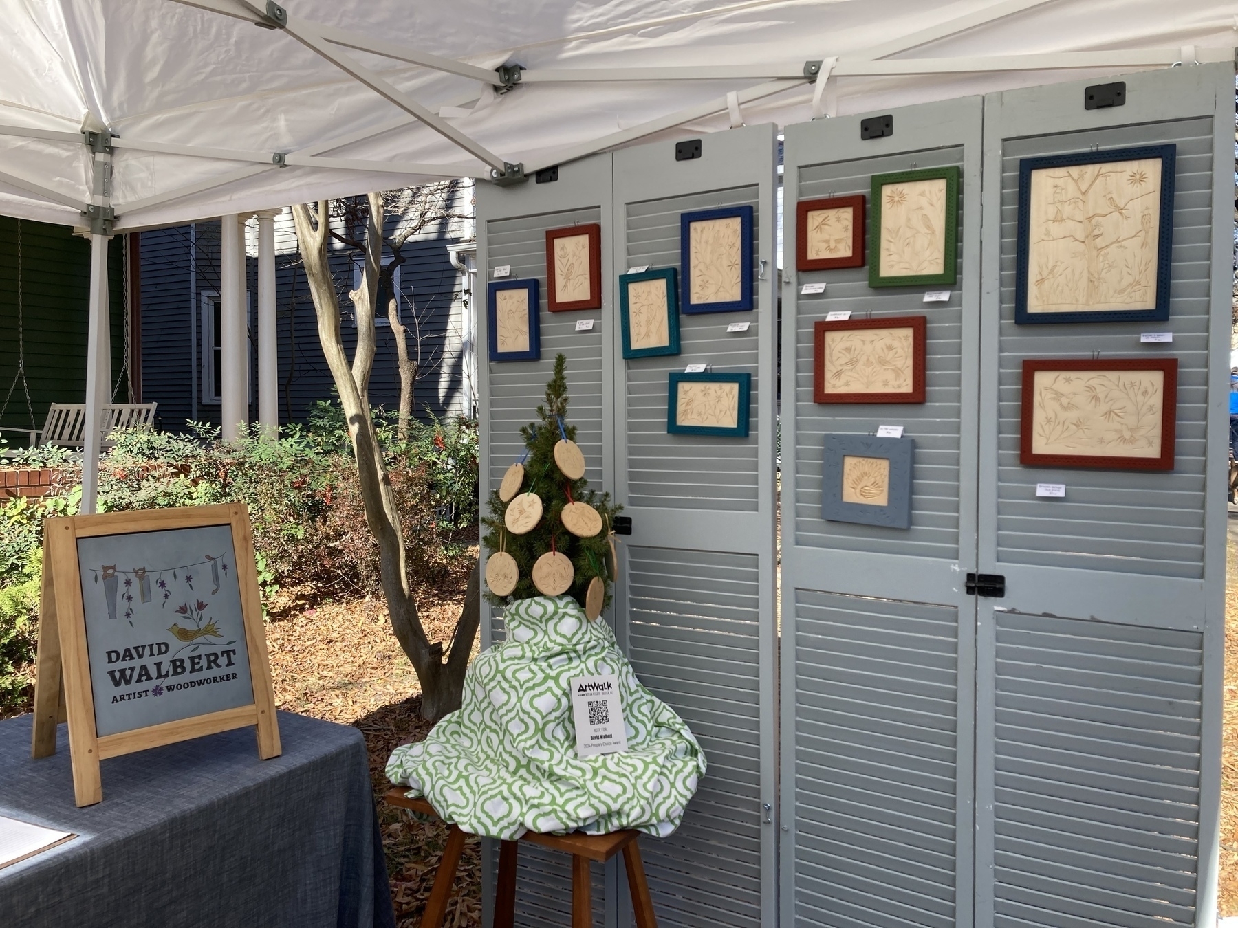 My booth with framed carvings