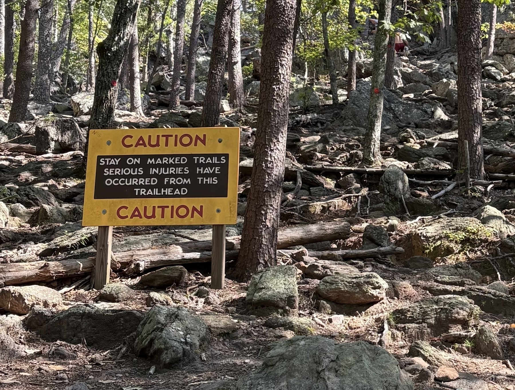 closeup on sign: CAUTION: serious injuries have occurred from this trailhead