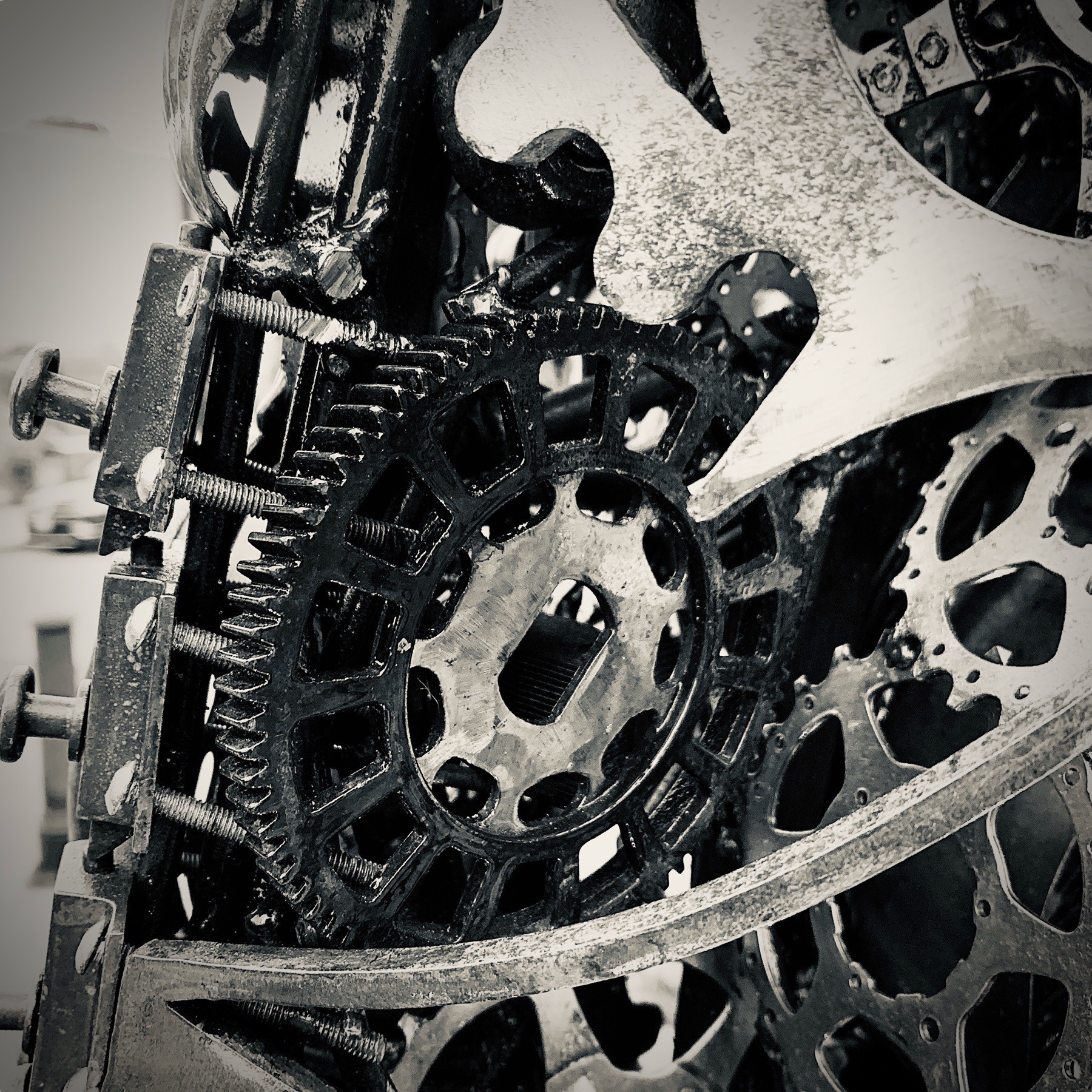 Close up of bicycle gears and sprockets from a sculpture.