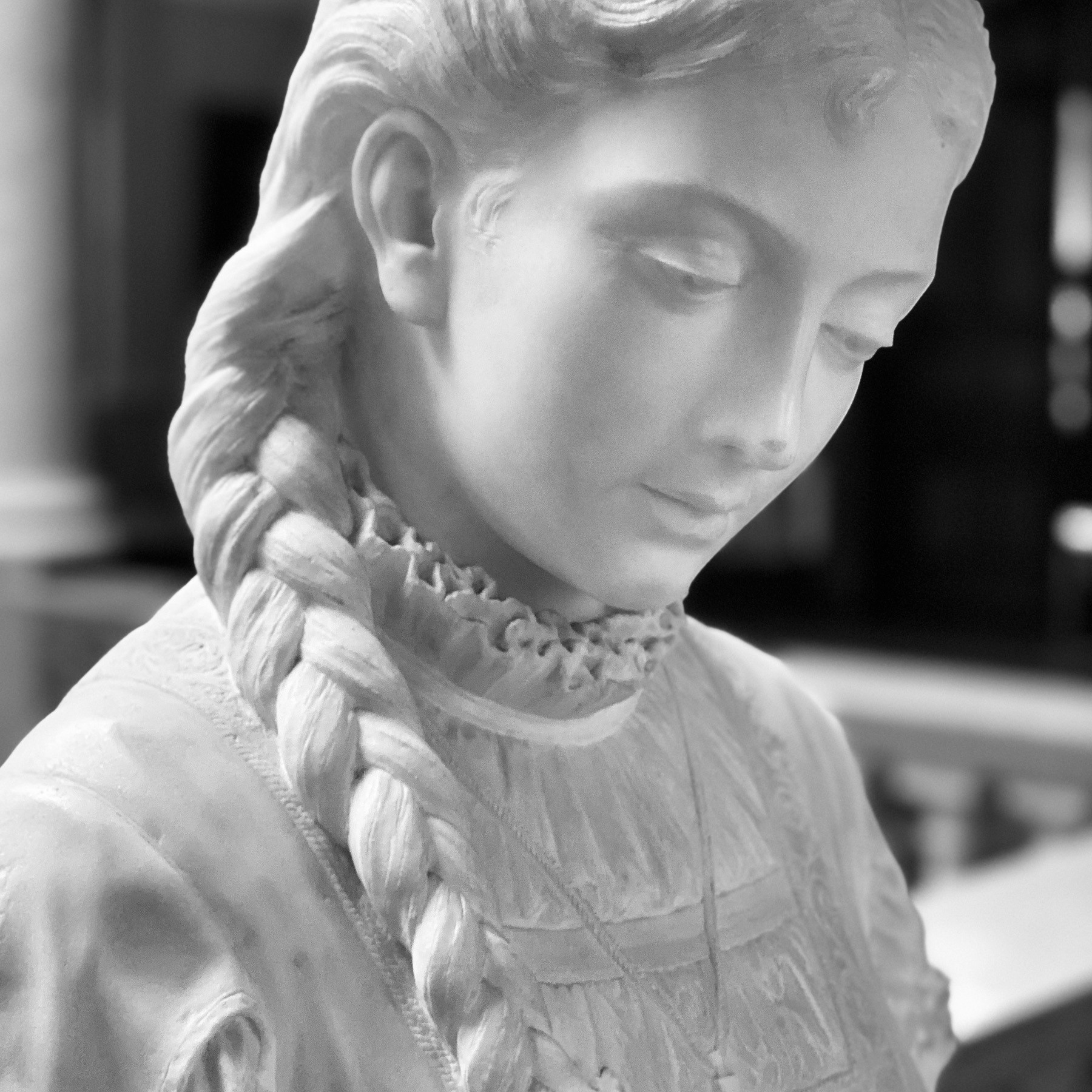 Statue bust of young woman. 