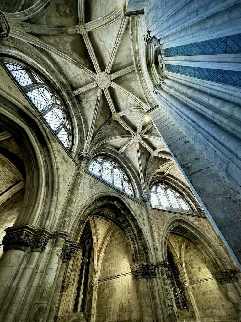 Looking upward at a cathedral ceiling. 