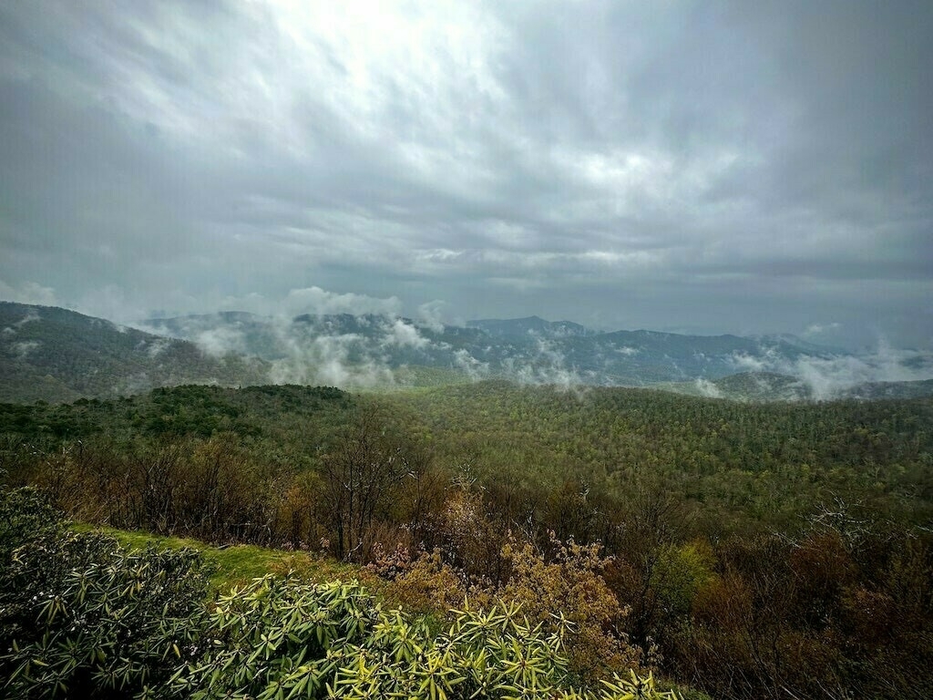 Cloudy view of Blue Ridge Mountains, green valley below